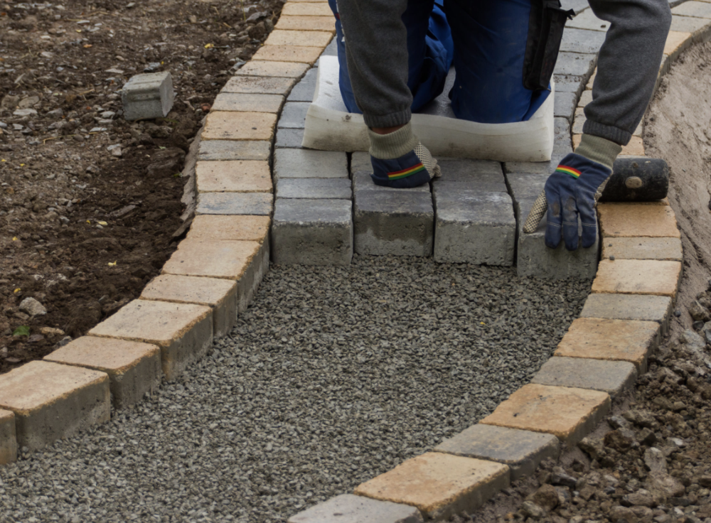 Professional outdoor works including paving and external improvements.