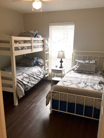 bunk bedroom with twin sleeps 3