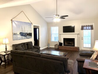 A-frame living room with hardwood vinyl throughout home