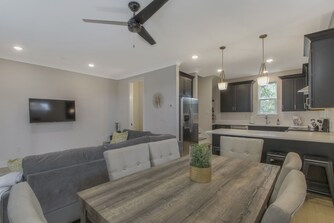 Dining room area behind living room next to kitchen