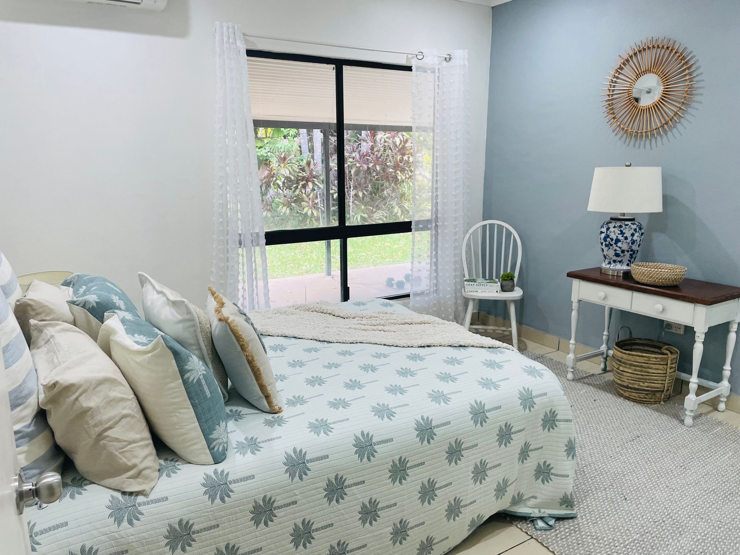 Soft, cohesive bedroom styling that balances natural light, textiles and tone for a calm, inviting atmosphere.