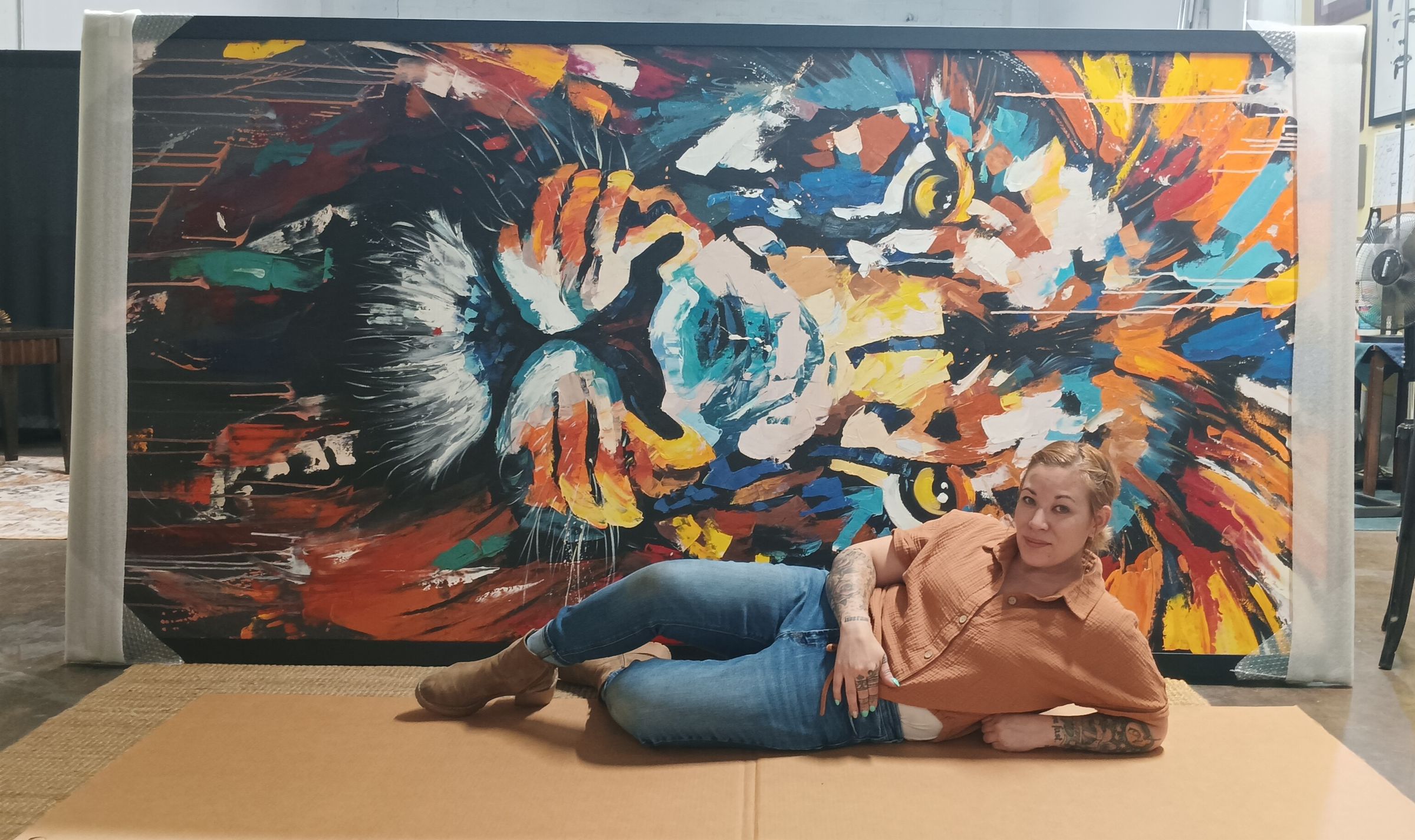 Athena with yet another large piece stretched and framed!