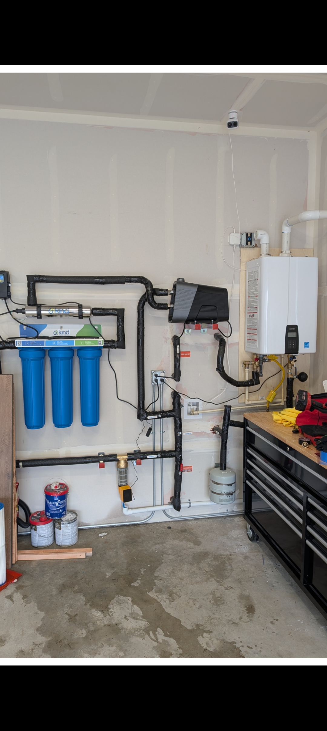 Customer upgrades include; Navien 240A with recirculation pump, whole house water filtration system with UV light, spin down filter and water pressure booster pump 