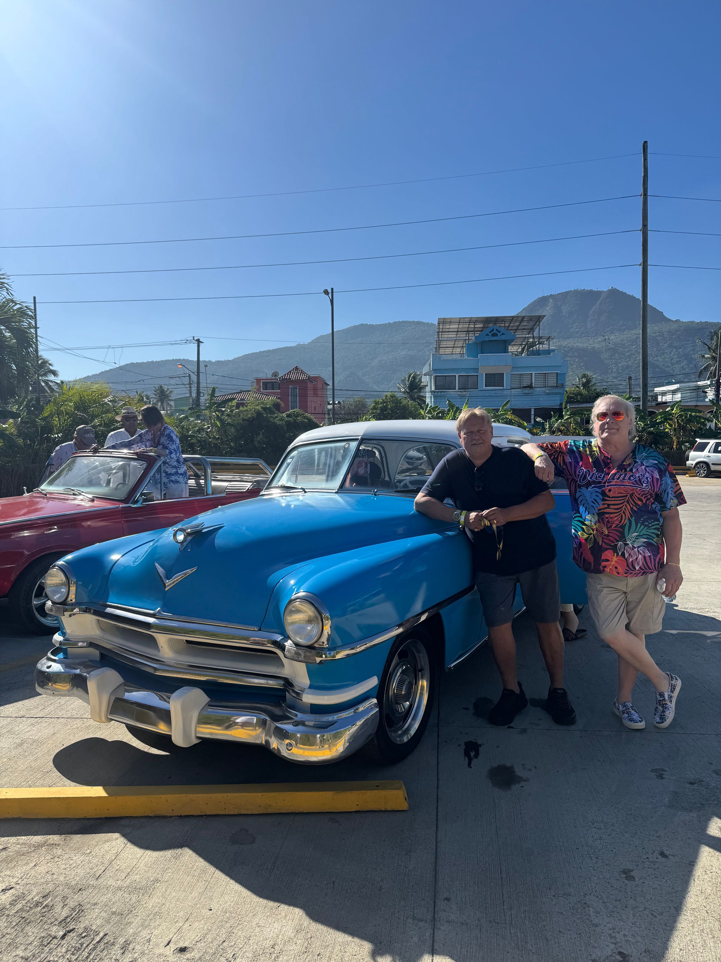 Jim and Robert relax before a Classic Car Ride around Ports Plata during offshore adventures while performing on the Celebrity Cruise Ship 