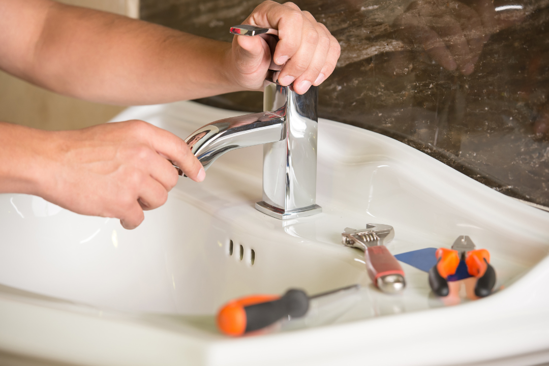 plumber installing sink