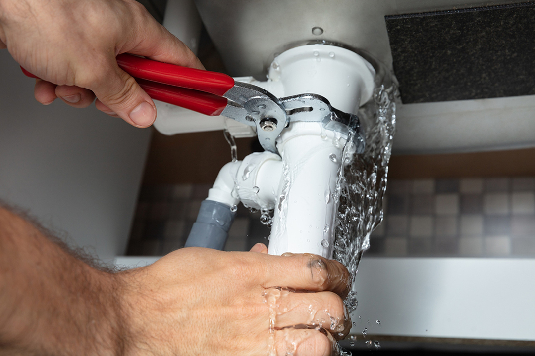plumber repairing sink