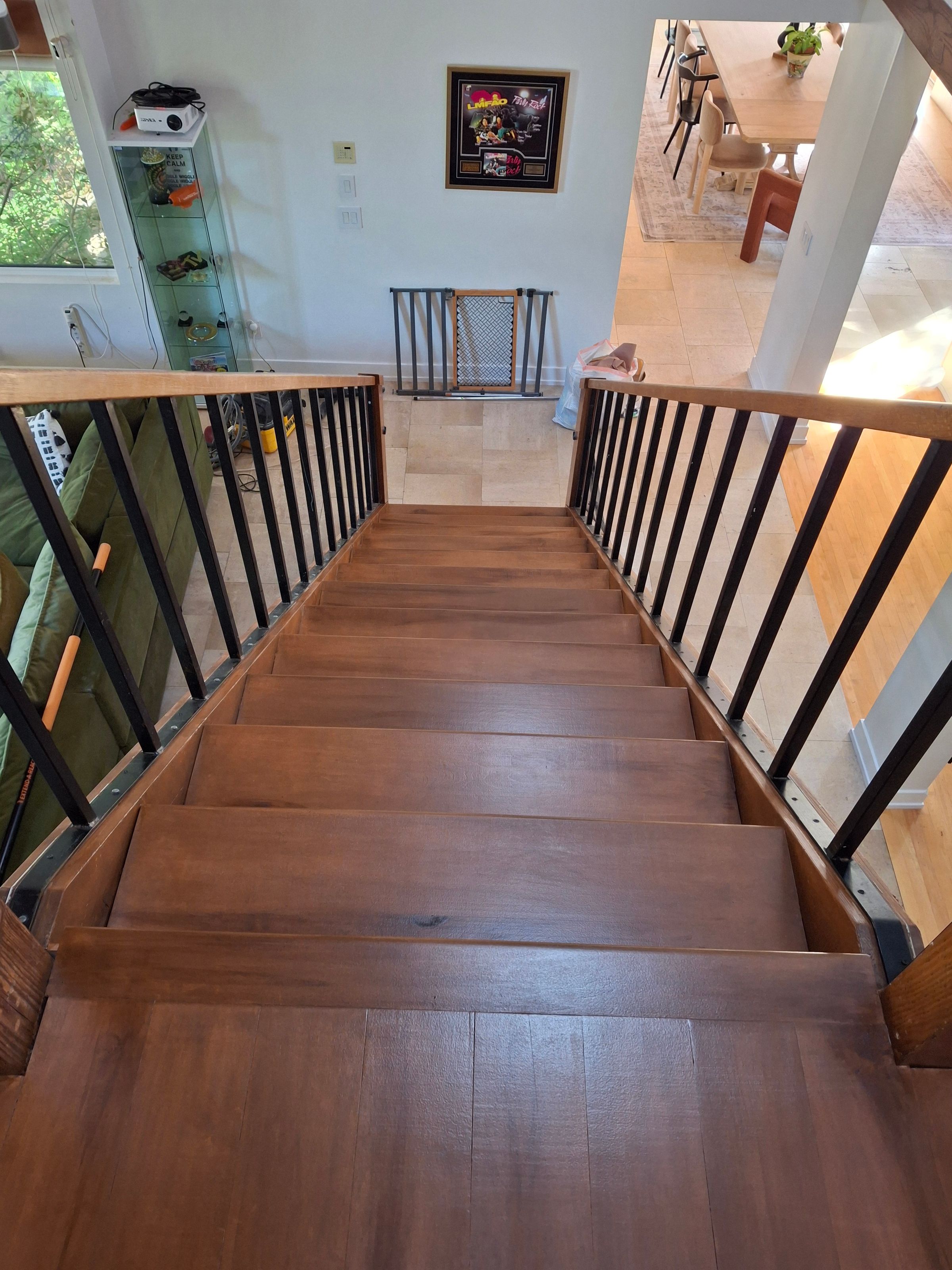 Staircase restoration – polished hardwood and detailed railing work