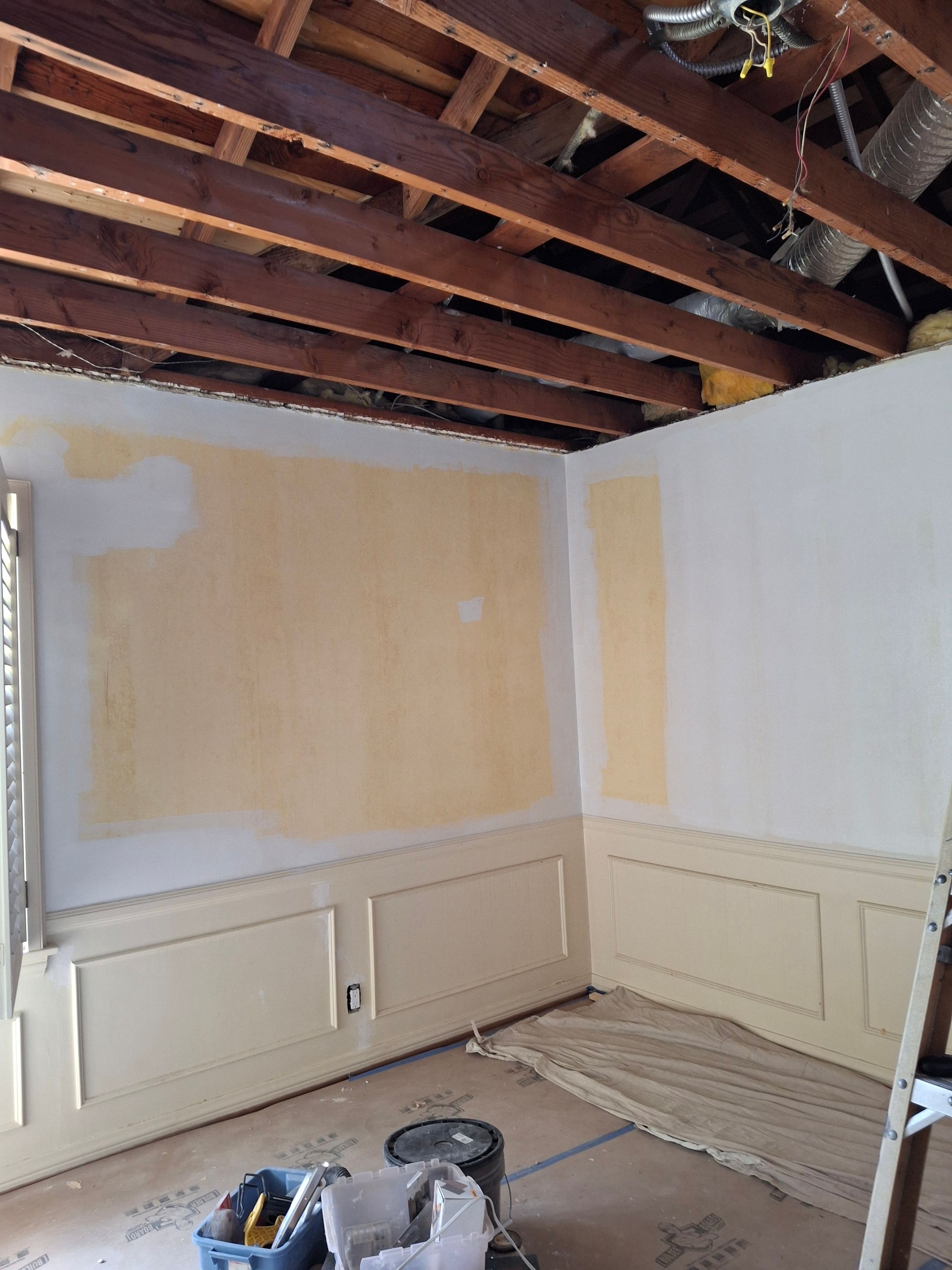 Wall refinishing – plaster and primer application during remodel