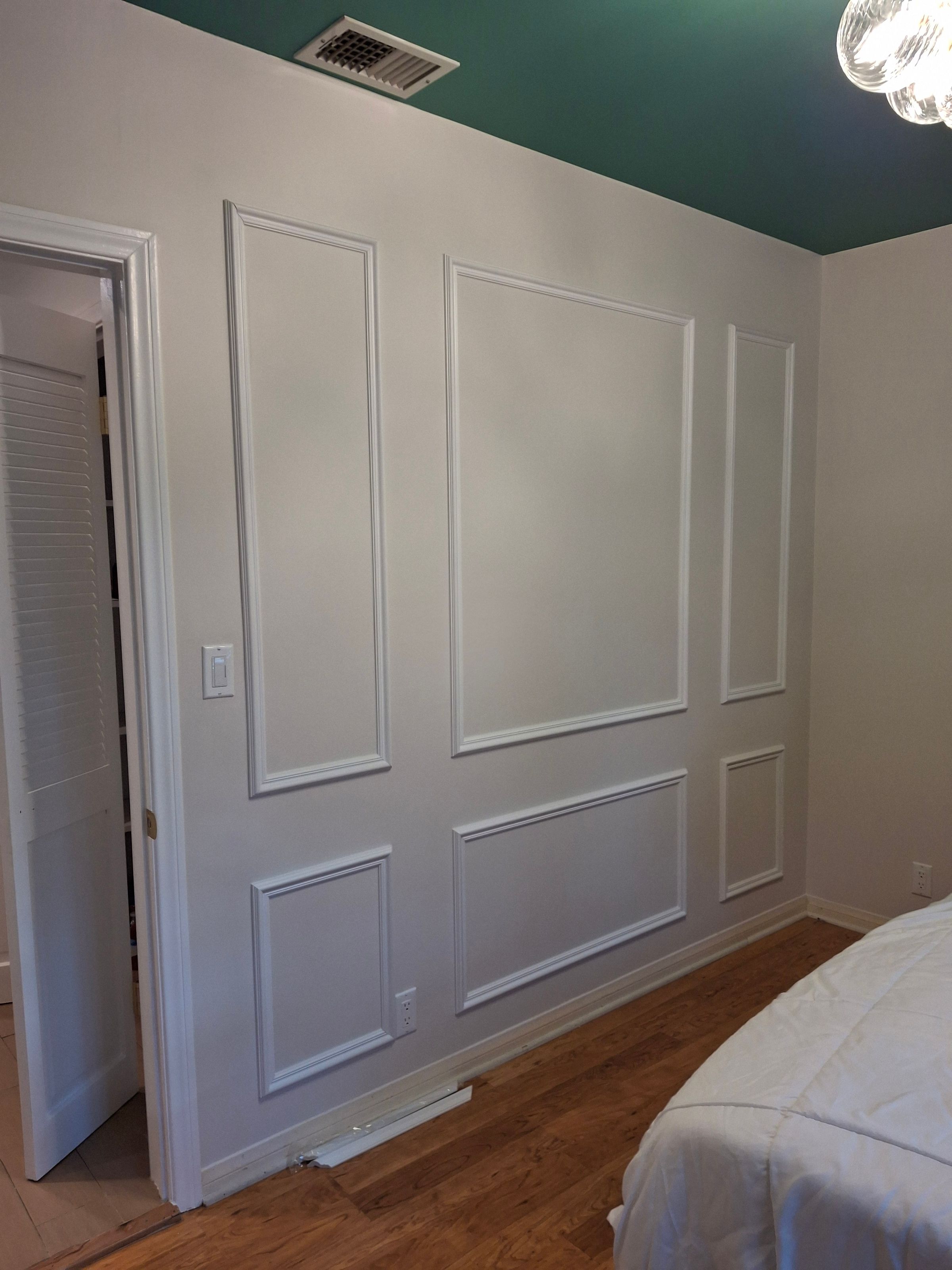 Custom wall molding – painted white panels and modern trim work