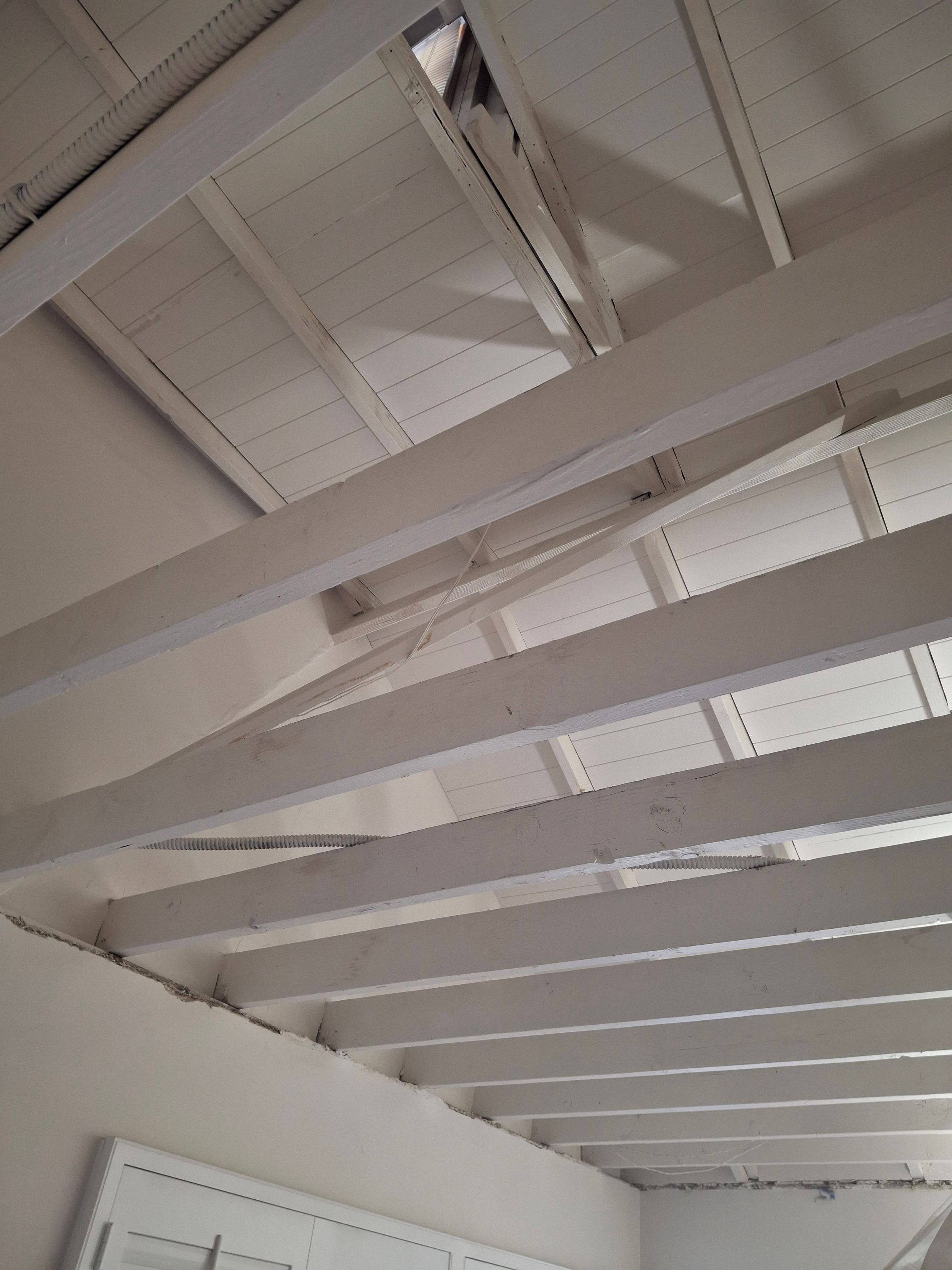 Painted ceiling beams – modern white finish and clean lines