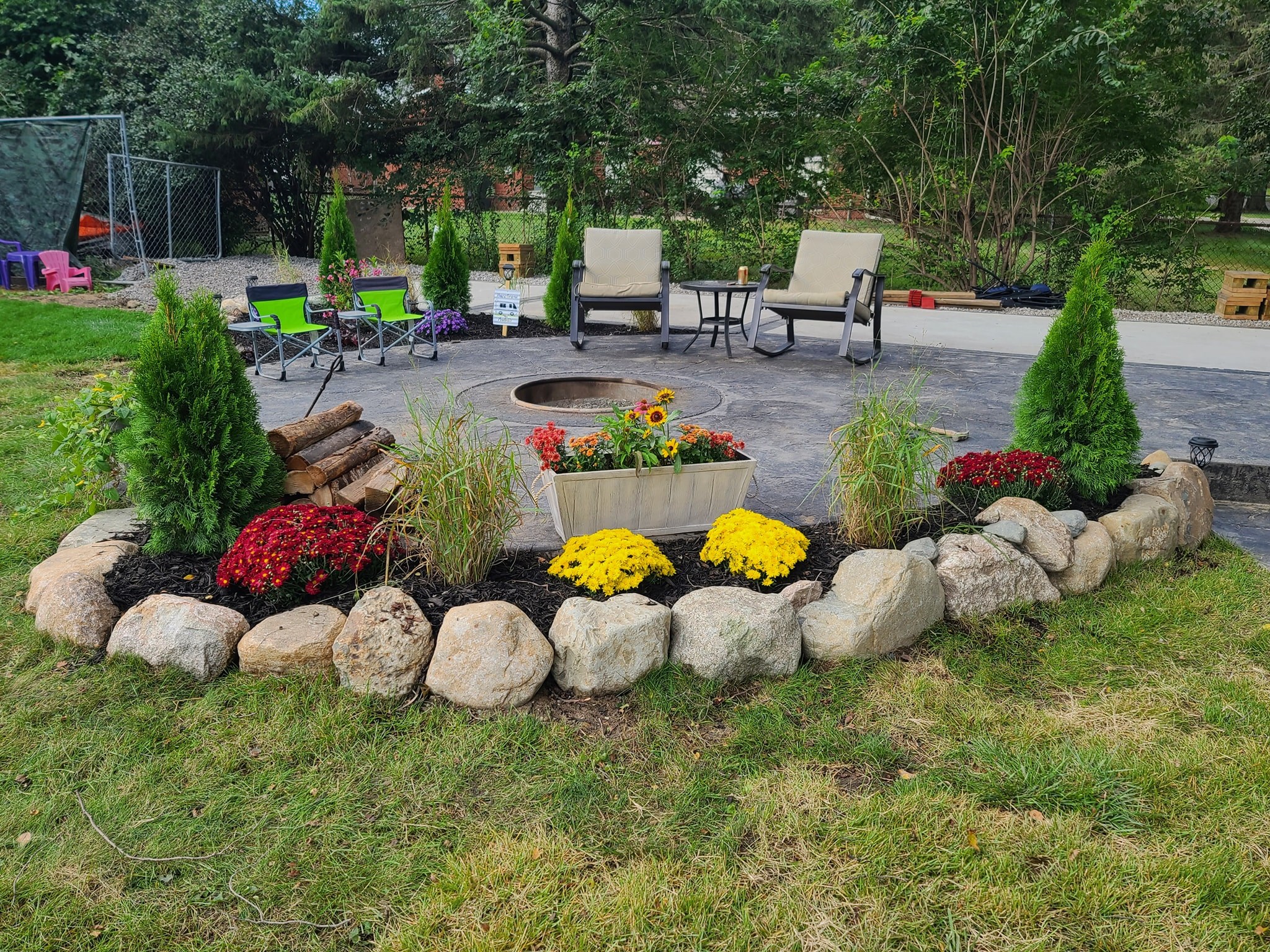 Stamped fire pit inlay patio with attached camper Pad