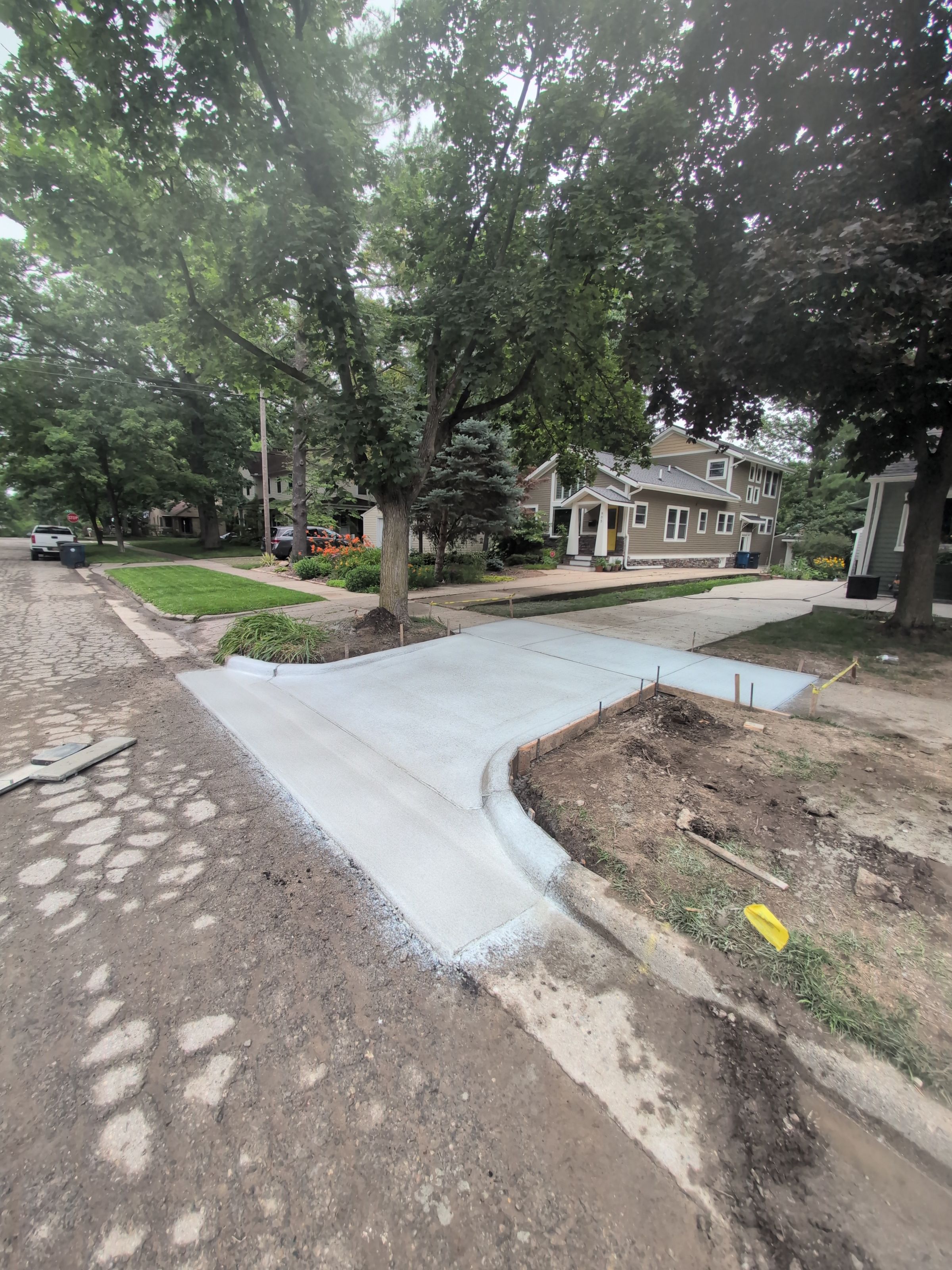 Approach Sidewalk addition with curb