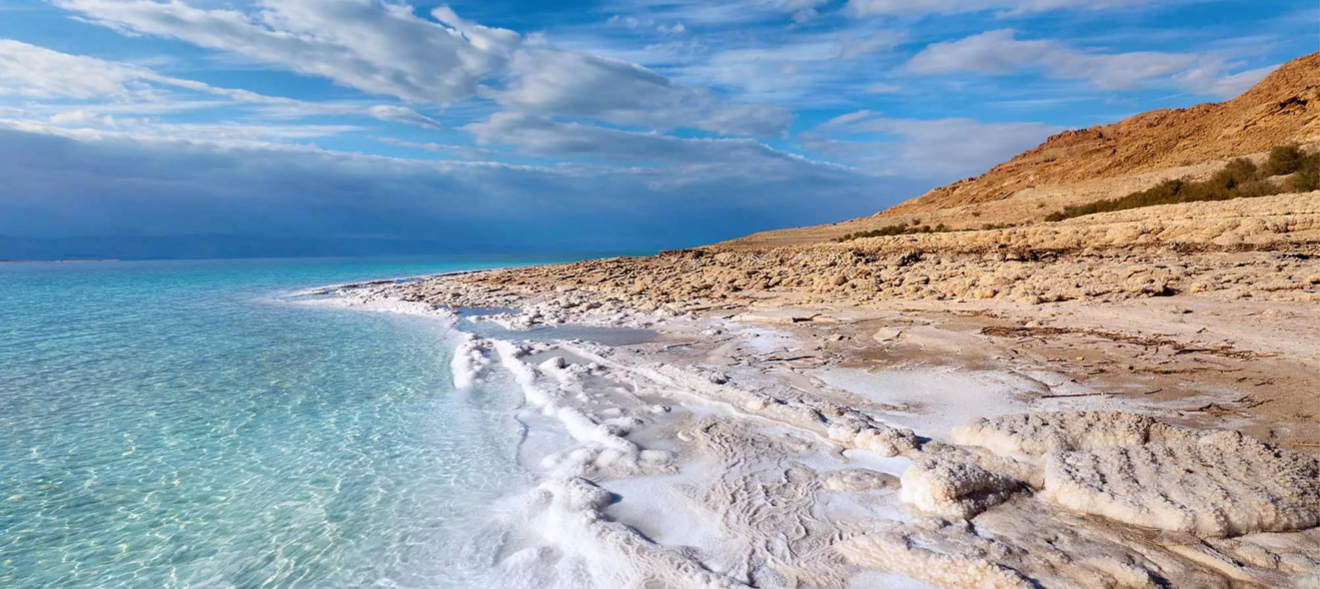 The Dead Sea in Jordan is the lowest point on Earth, sitting more than 400 meters below sea level, and it is one of the world’s most unique natural wonders. Its waters are so salty that you float effortlessly, while the mineral-rich mud is renowned for its healing and rejuvenating powers. Surrounded by dramatic desert mountains and steeped in ancient history, the Dead Sea is also a place of deep spirituality, with nearby sacred sites like Bethany Beyond the Jordan. As the sun sets, the horizon glows with golden and violet hues, making every visit a blend of natural beauty, wellness, and timeless heritage.