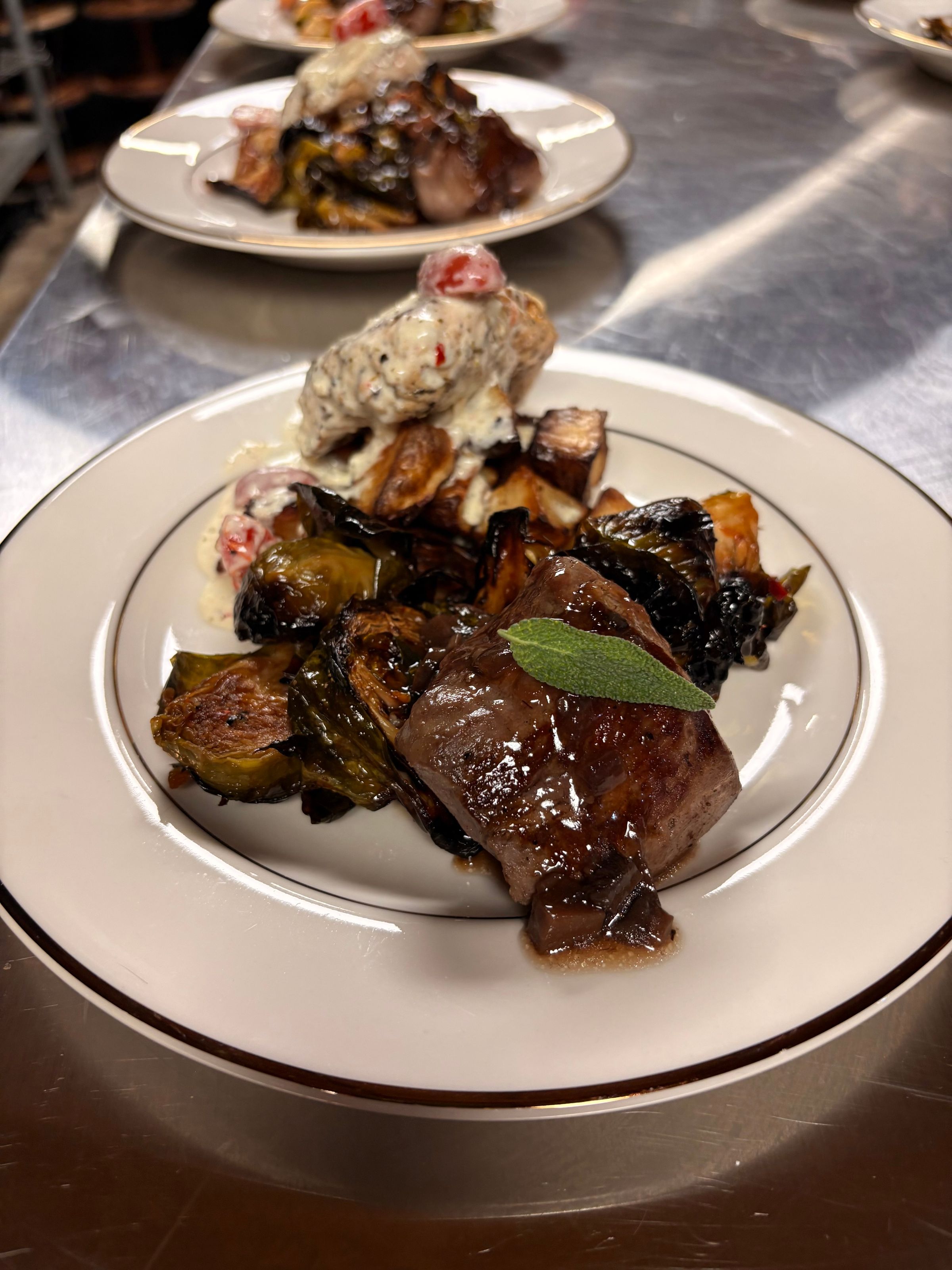 Caprese Chicken, Filet Medallion, Roasted Red Potatoes, Chili Balsamic Brussels