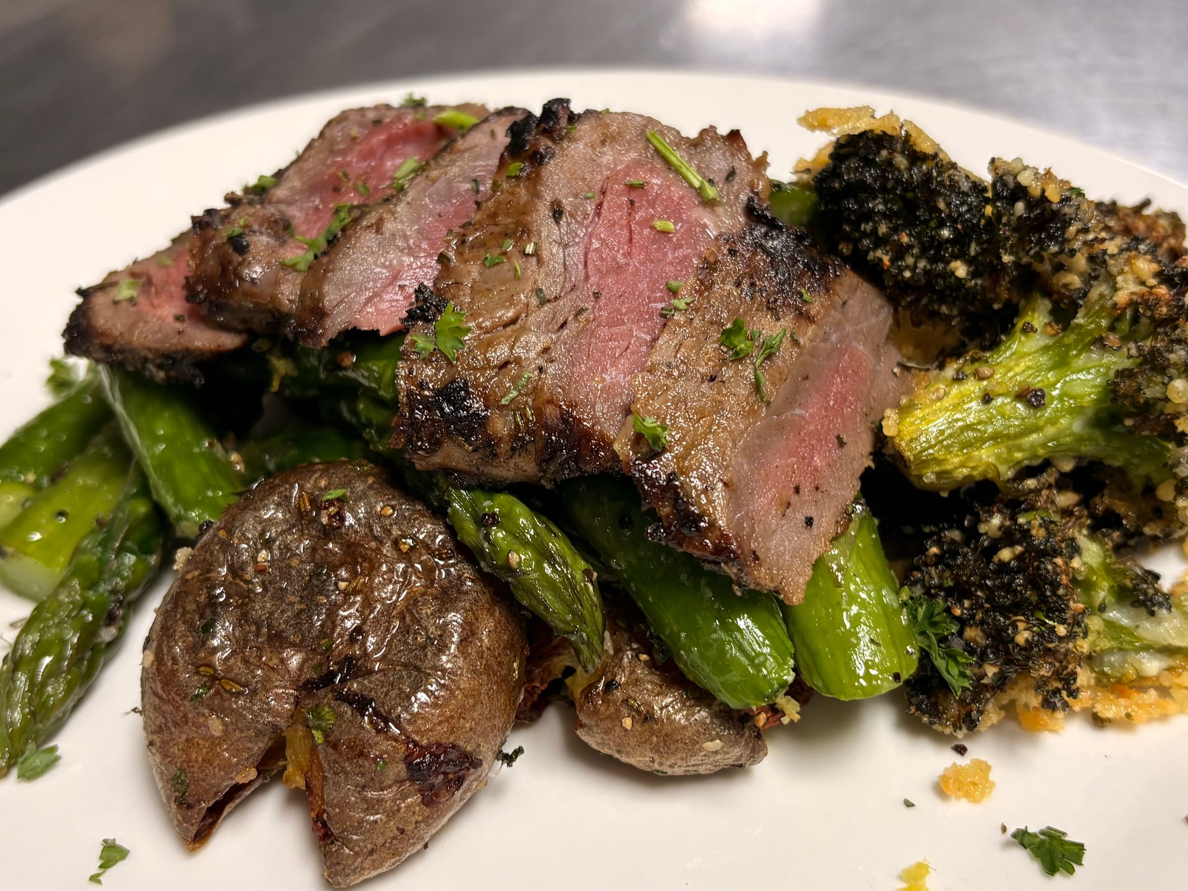 Garlic & Herb Striploin with Smashed Fingerling Potatoes and Parmesan Broccoli