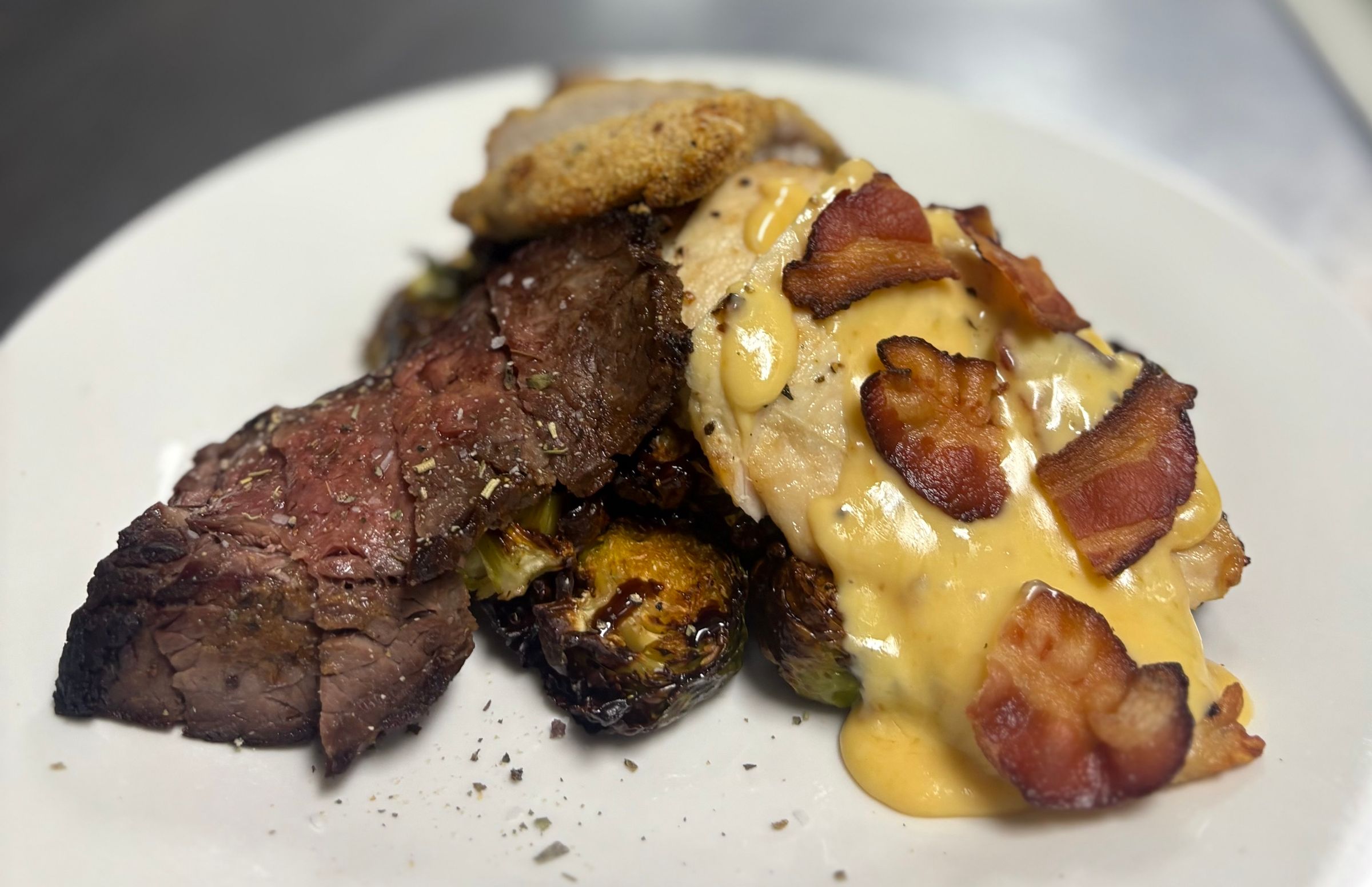 Parmesan Crusted Chicken, Gouda Bacon Chicken, Garlic & Herb Striploin, & Chili Balsamic Brussel Sprouts