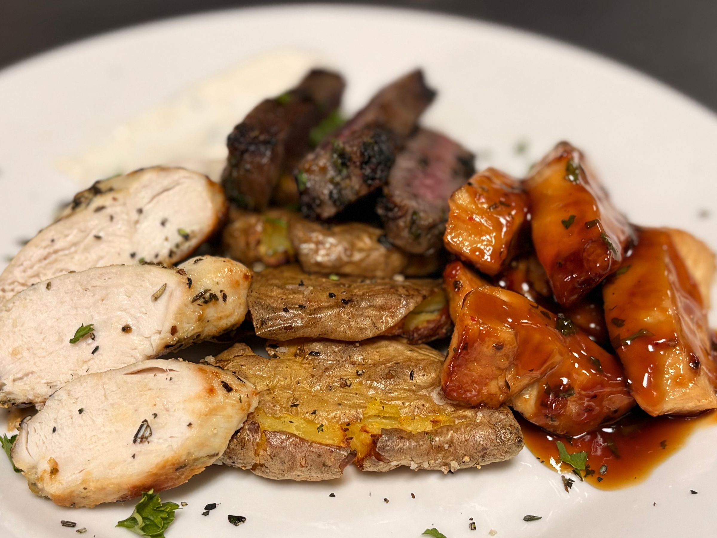 Smashed Fingerling Potatoes, Teriyaki Chicken, Herb Marinated Chicken, Garlic & Herb Striploin