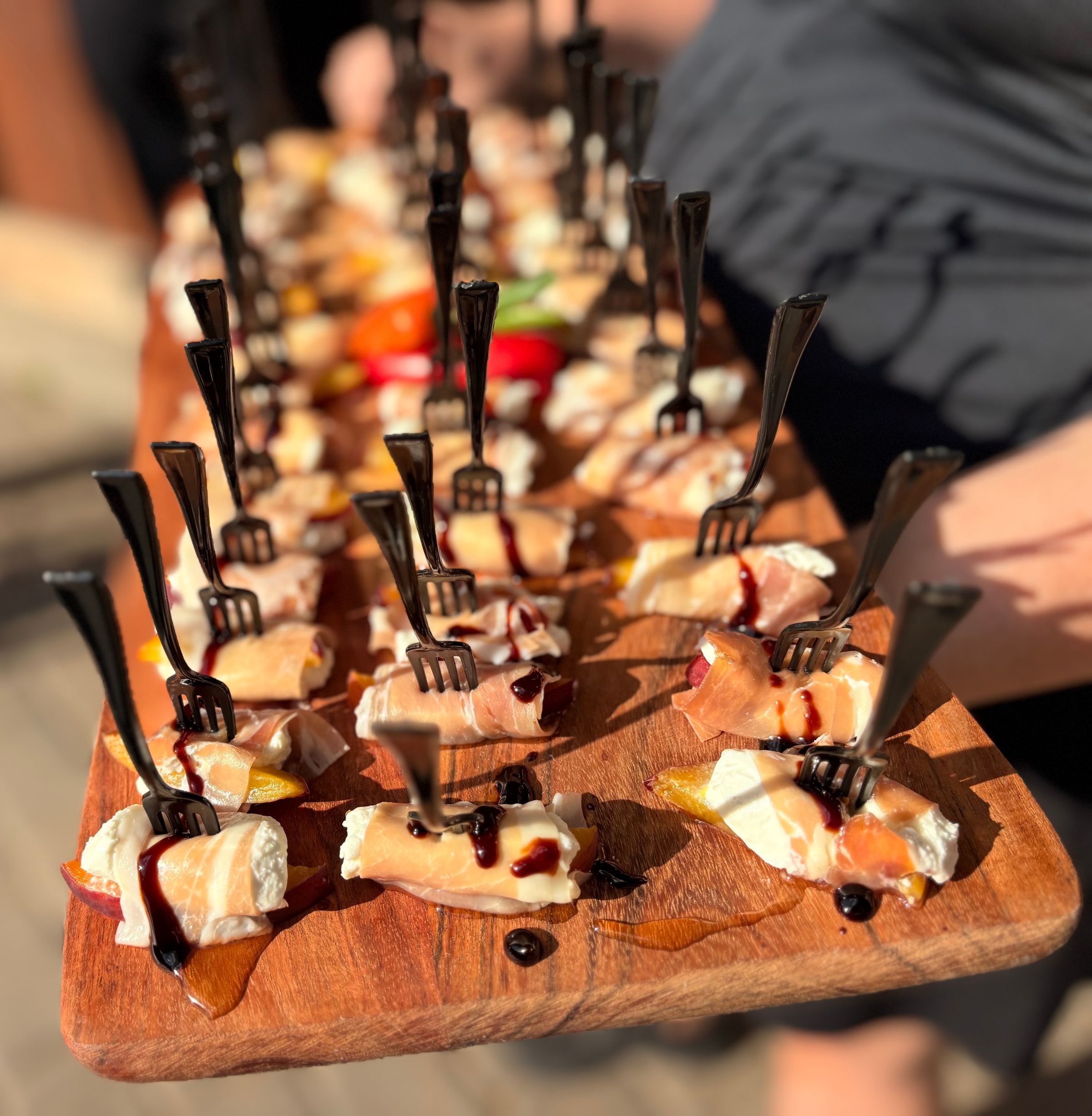 Peach, Honey Goat Cheese wrapped in Prosciutto with Balsamic Glaze and Honey Drizzle 