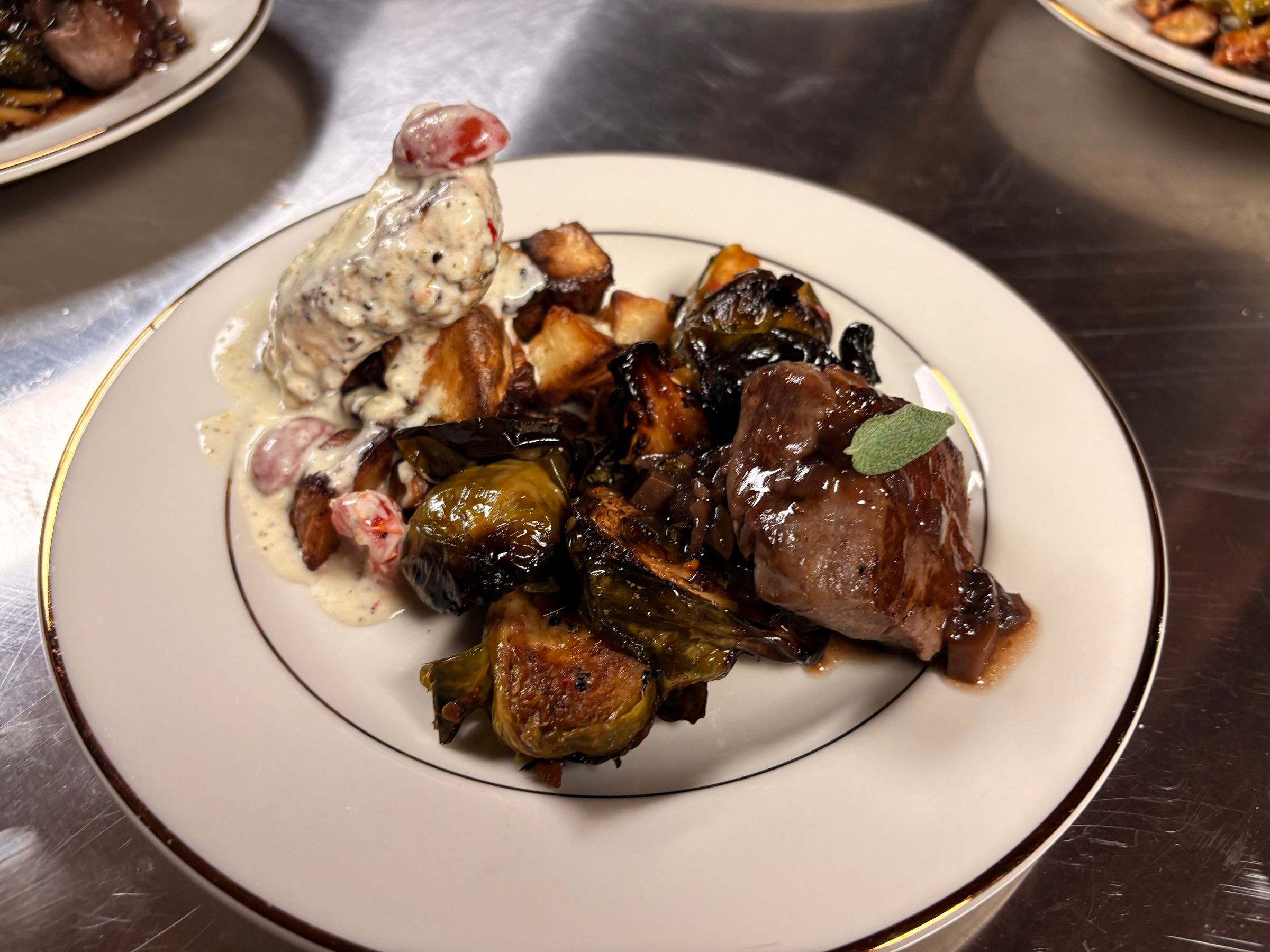 Caprese Chicken, Filet Medallion, Roasted Red Potatoes, Chili Balsamic Brussels