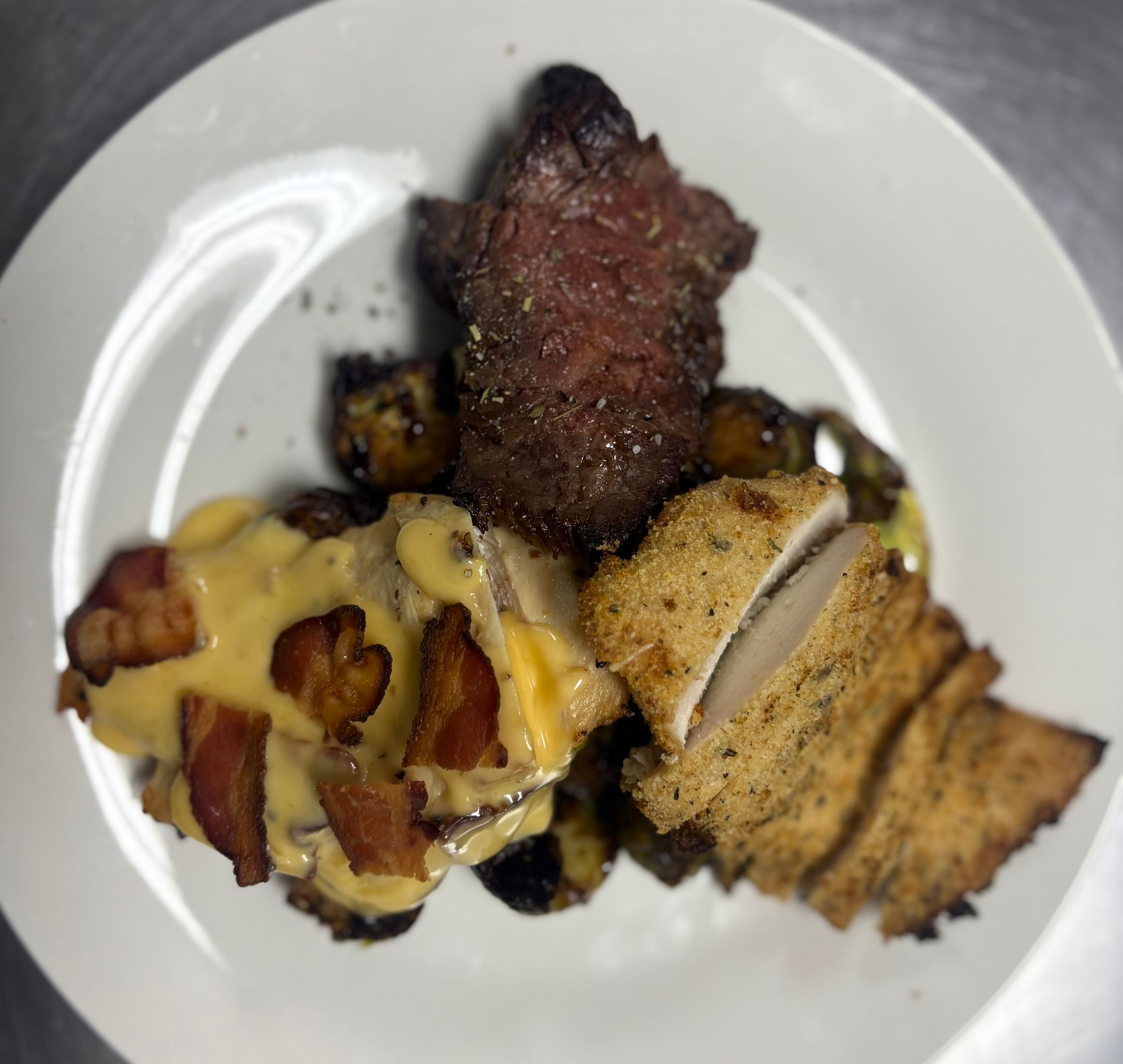 Parmesan Crusted Chicken, Gouda Bacon Chicken, Garlic & Herb Striploin, & Chili Balsamic Brussel Sprouts