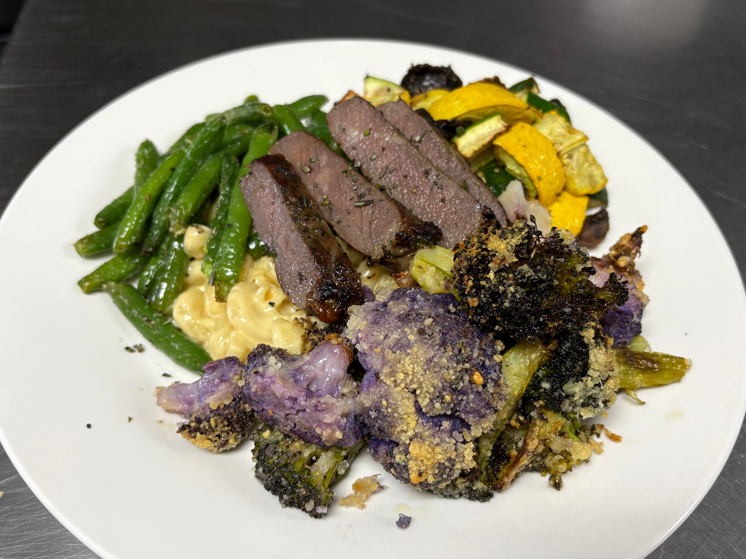 Fresh Green Beans, Zucchini, Squash, Mushroom Medley, Tri-Colored Parmesan Cauliflower and Broccoli, Garlic & Herb Striploin