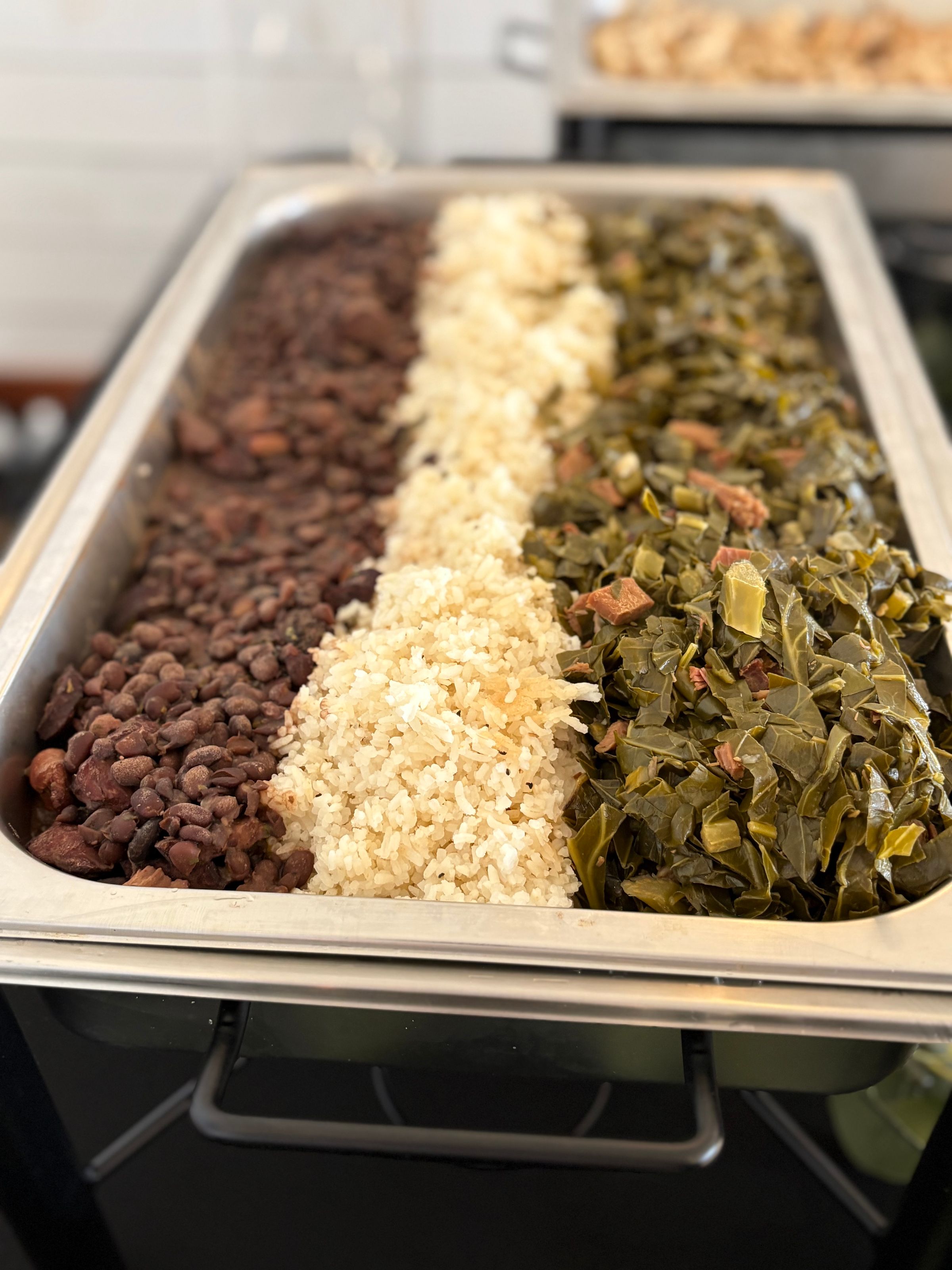 Feijoada - Jasmine Rice, Black Beans, Collard Greens, all cooked with bold Brazilian spices, Sausage, and Bacon.