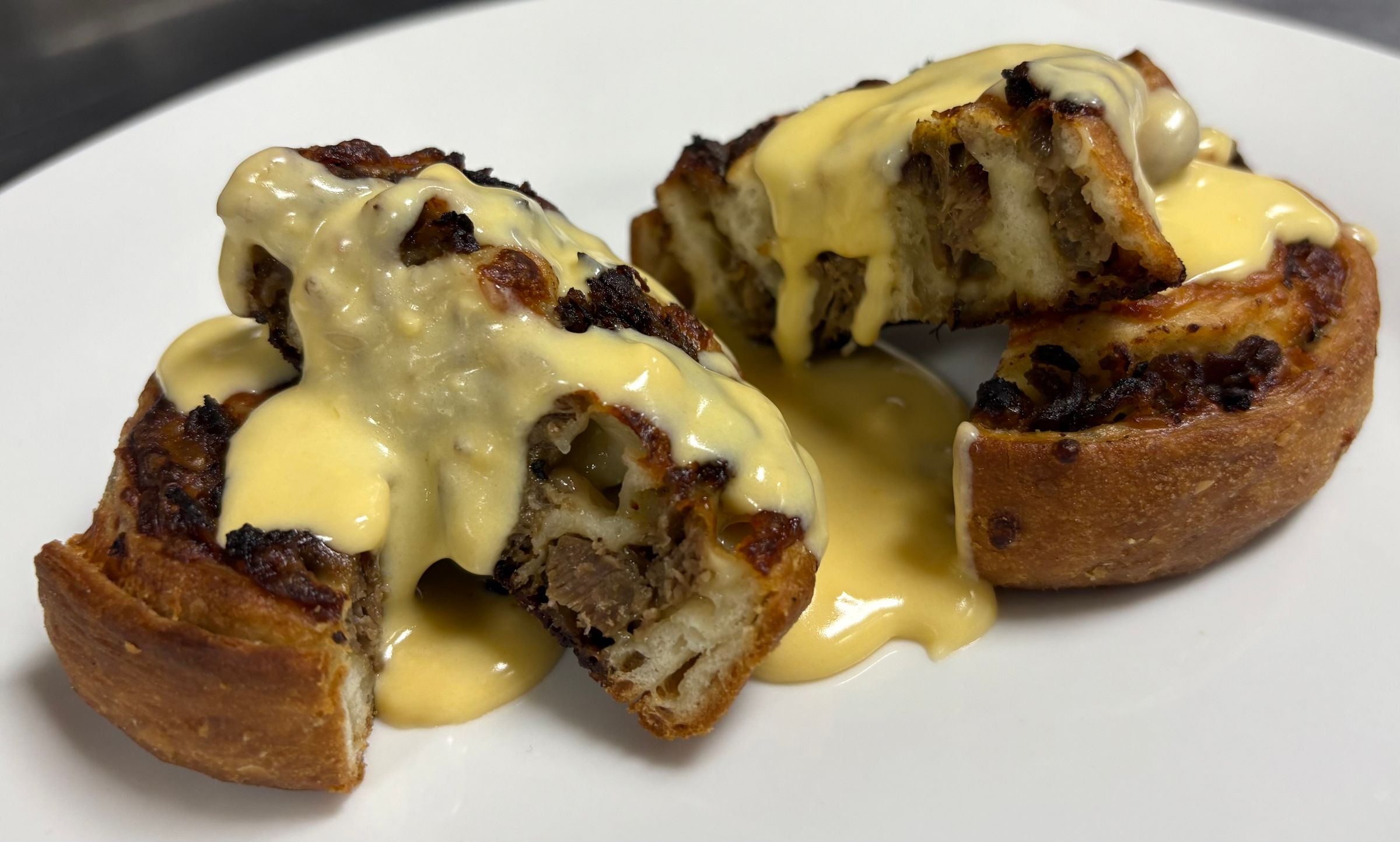 Philly Pinwheel with House Made Cheese Sauce