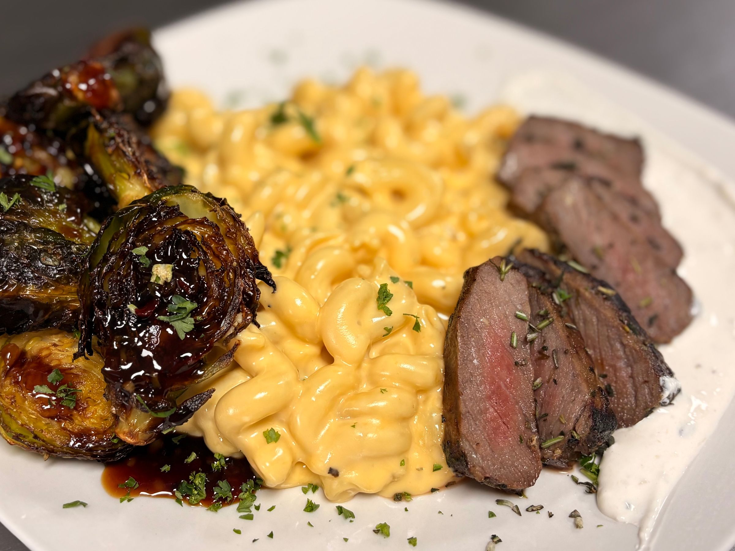 Chili Balsamic Brussels, Three Cheese Mac, Garlic and Herb Striploin