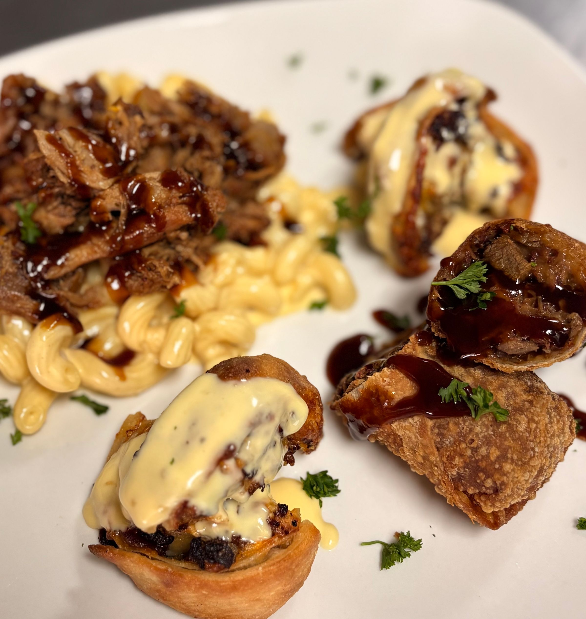 BBQ Three Cheese Mac, Philly Cheesesteak Pinwheel with House made Cheese Sauce, Brisket Egg Rolls