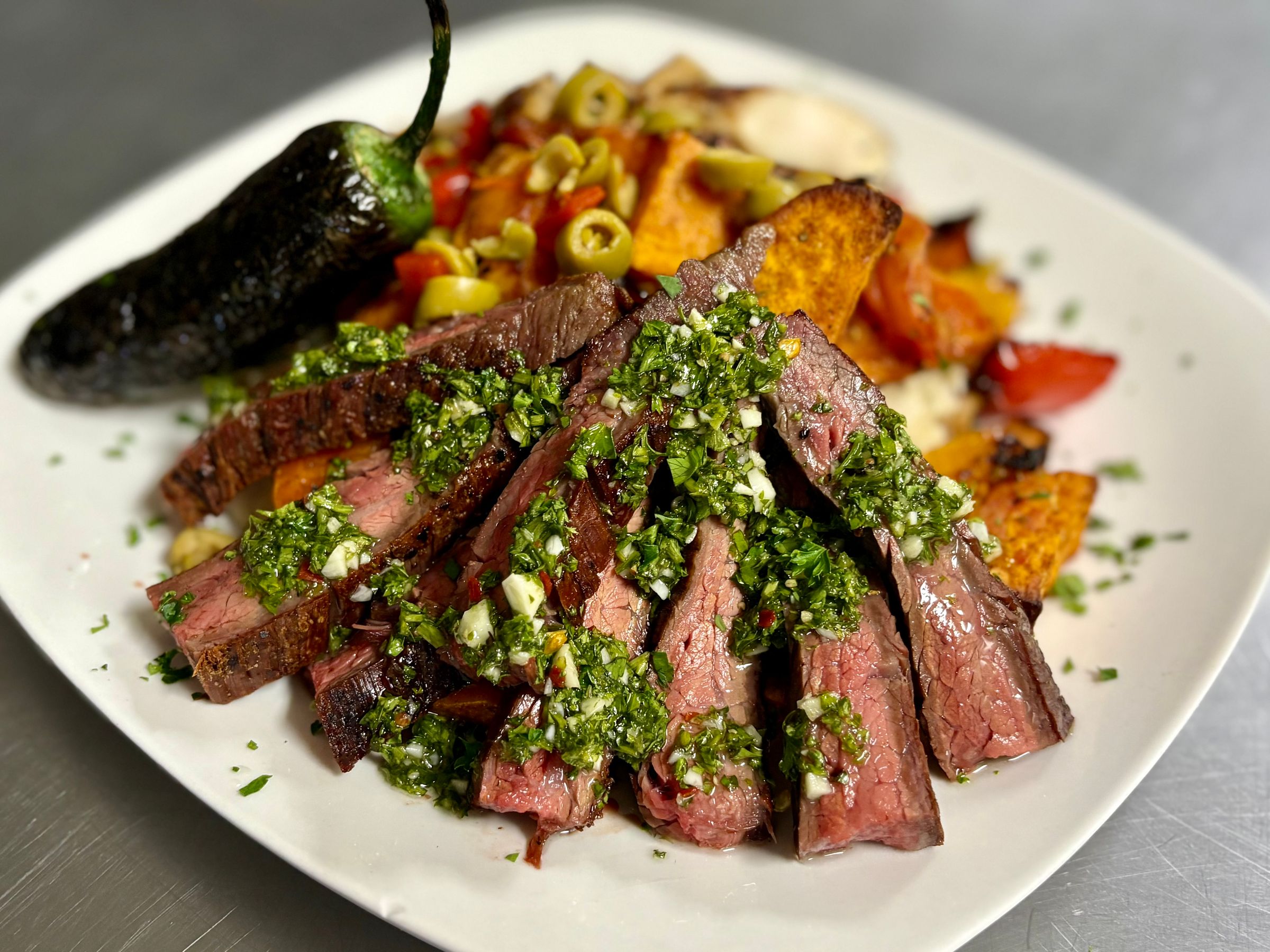 Flank Steak with House made Chimichurri with Brazilian Roasted Vegetables