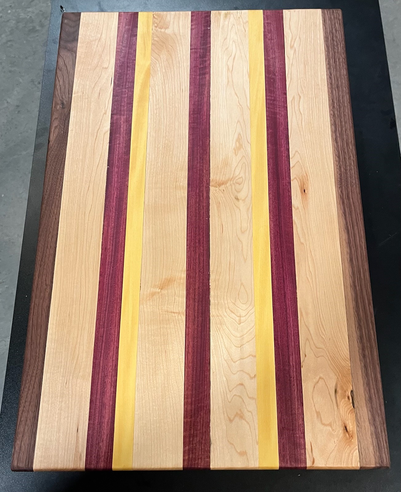 Long grain Yellow Heart, Purple Heart, Maple and Walnut cutting board