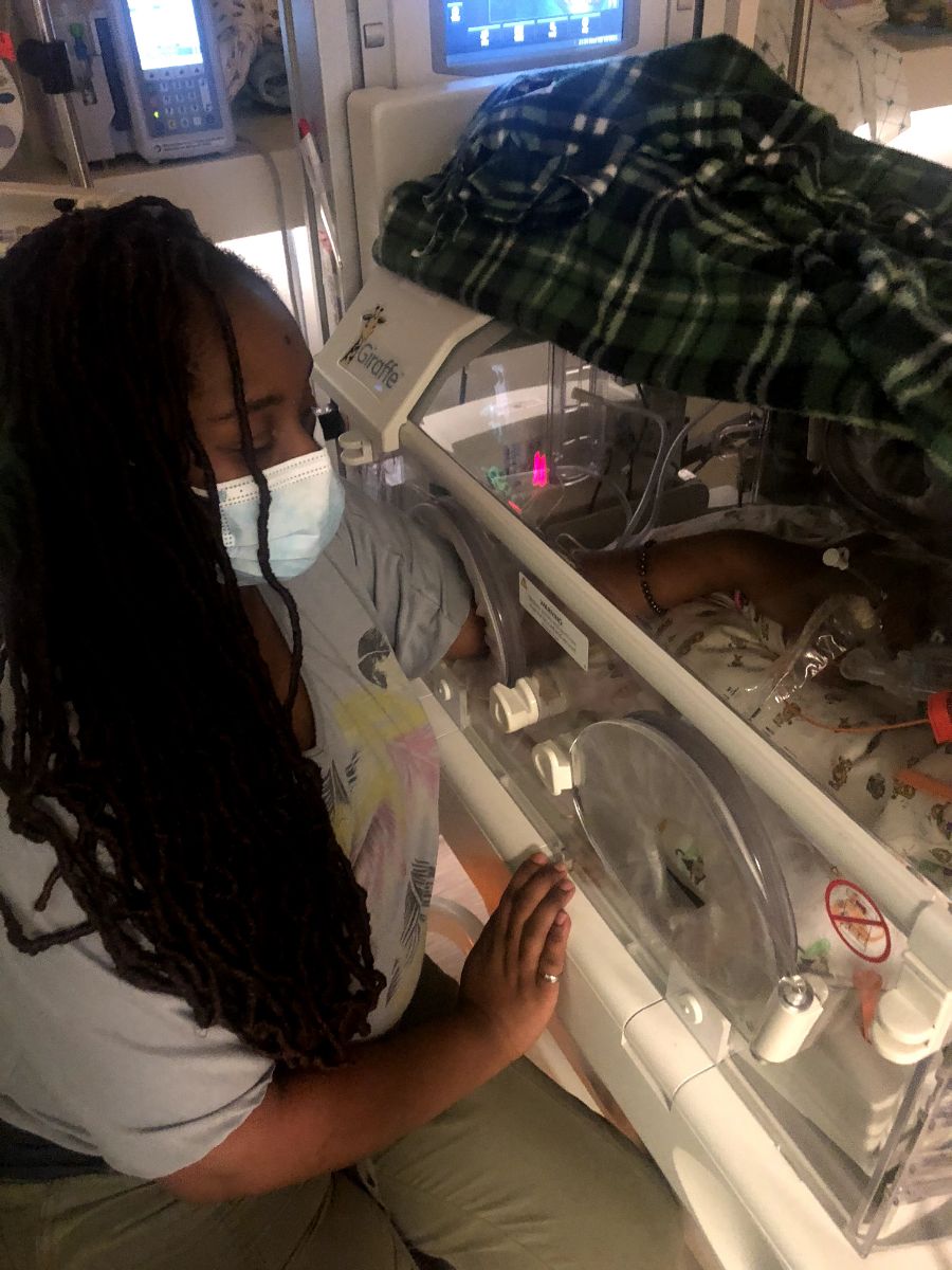 Me, LaShundra Wigfall, at my NICU warrior's bedside.