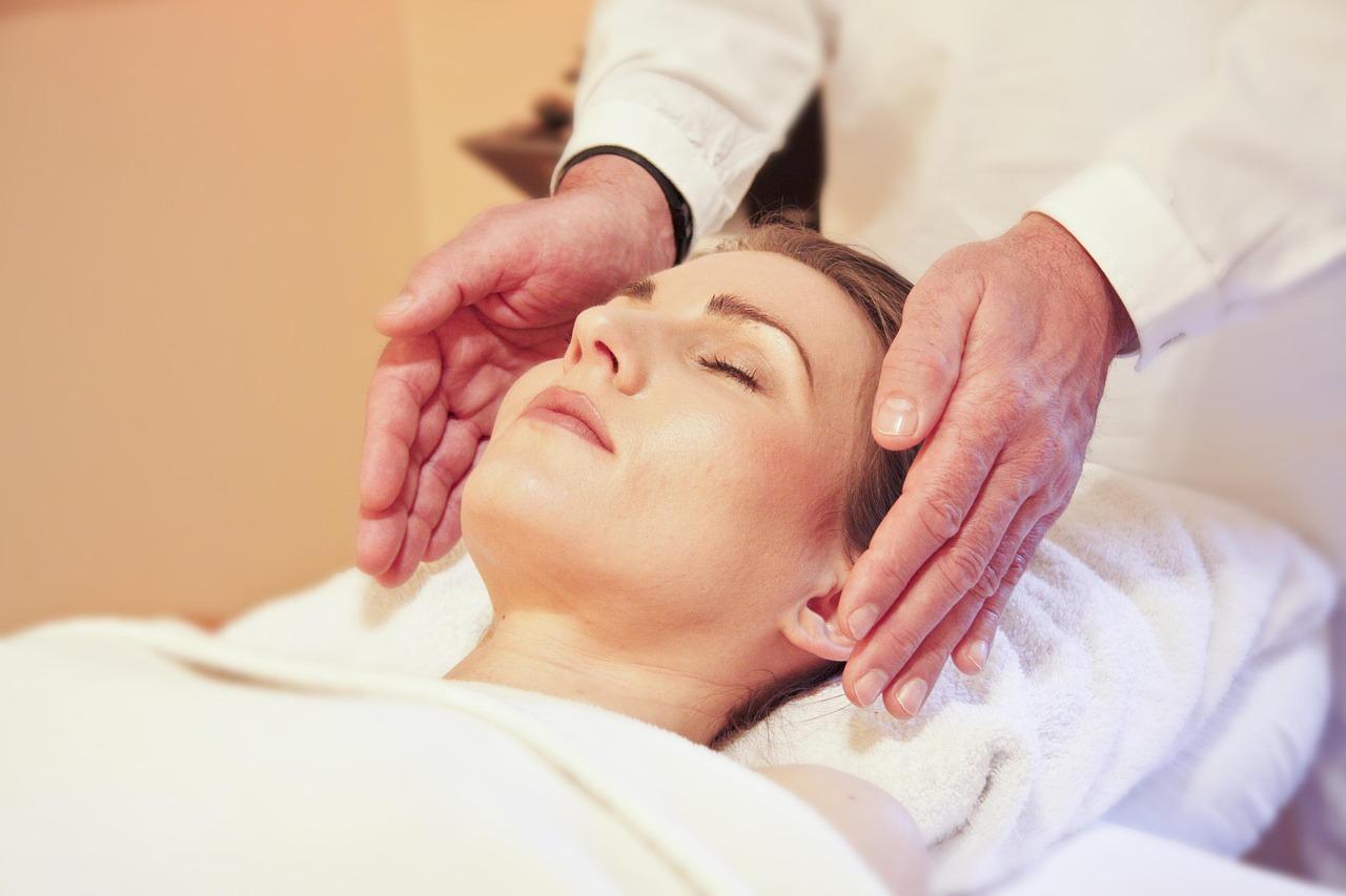 Reiki is a form of Japanese stress-reduction that involves a practitioner using their hands to guide energy through the body to promote relaxation. A practitioner places their hands lightly on or just above a person to channel "universal life energy" or "ki" to help clear blockages and restore balance to the biofield.