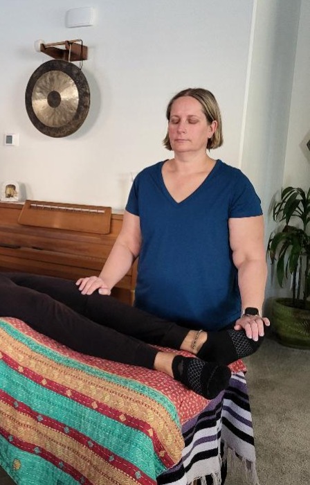 Beth giving Reiki with light touch