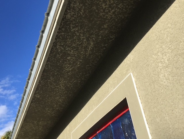 STUCCO APPLICATION IN PROGRESS