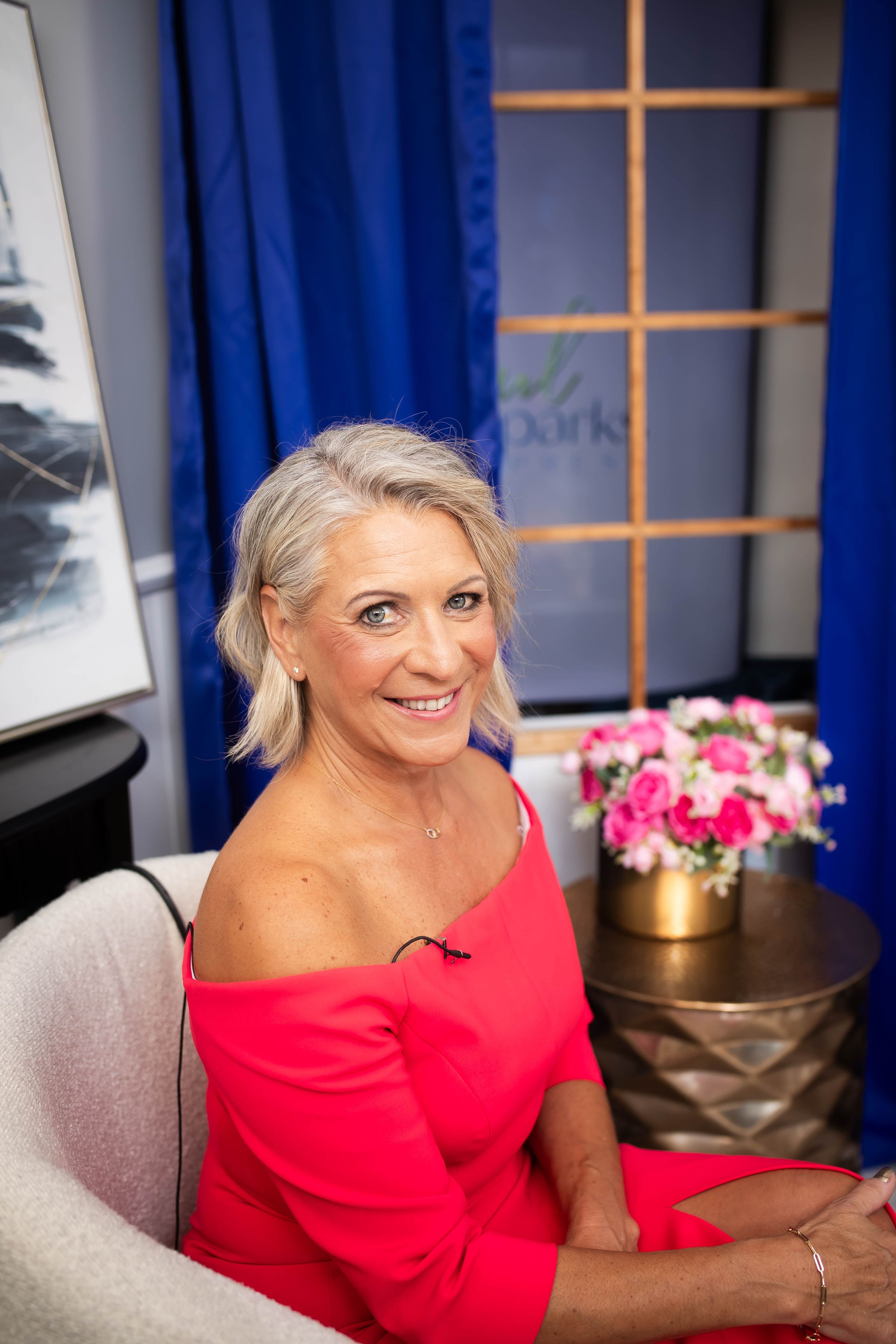 Michelle seated to welcome new clients in a comfortable private space.