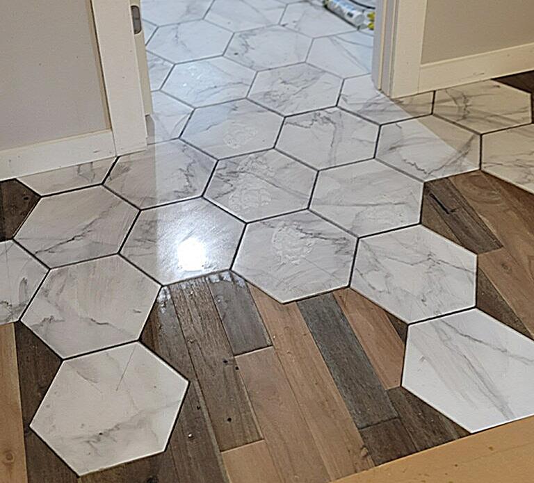 Tile Spilling Into Wood Flooring