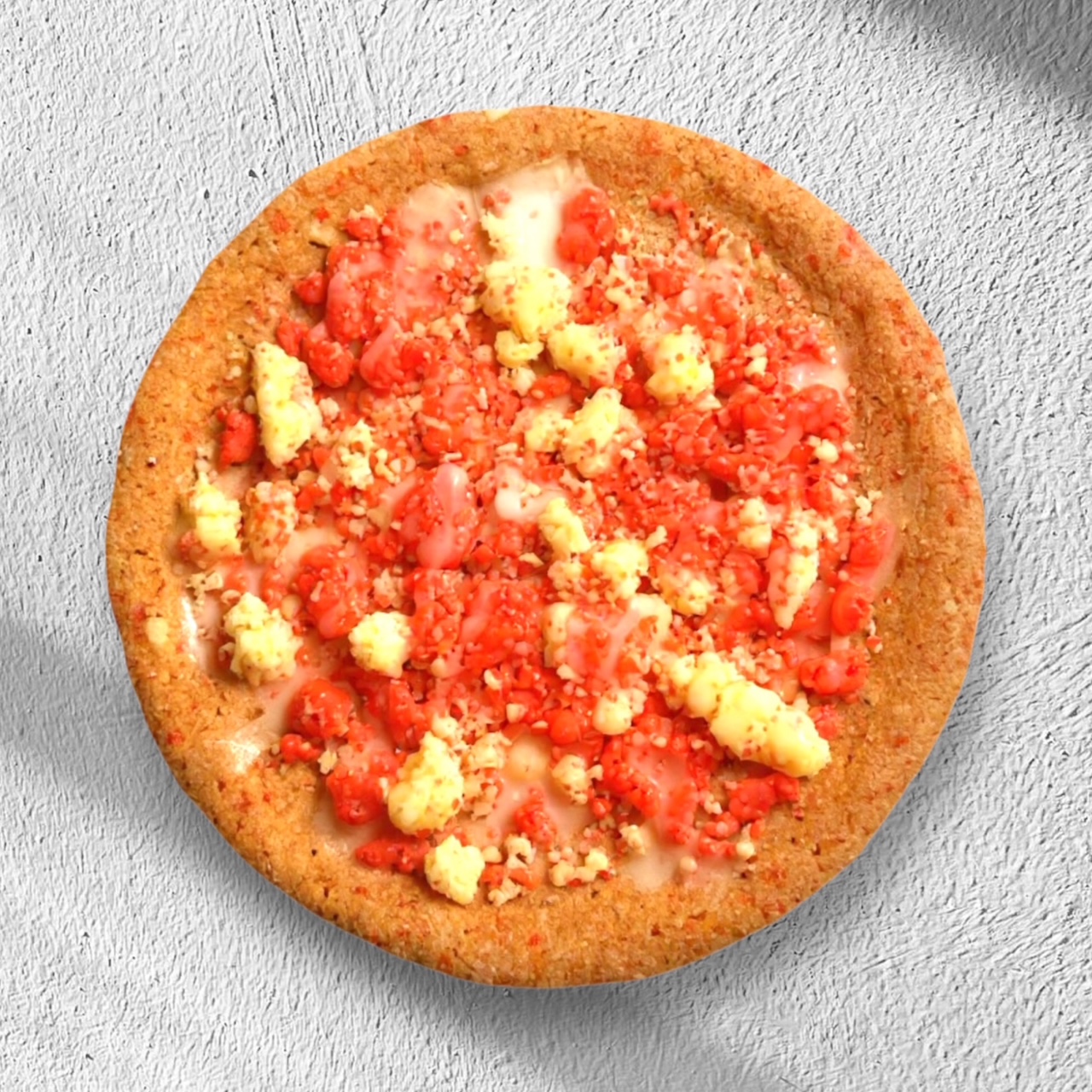 Strawberry flavored cookie topped with strawberry crunch and drizzled in glaze.