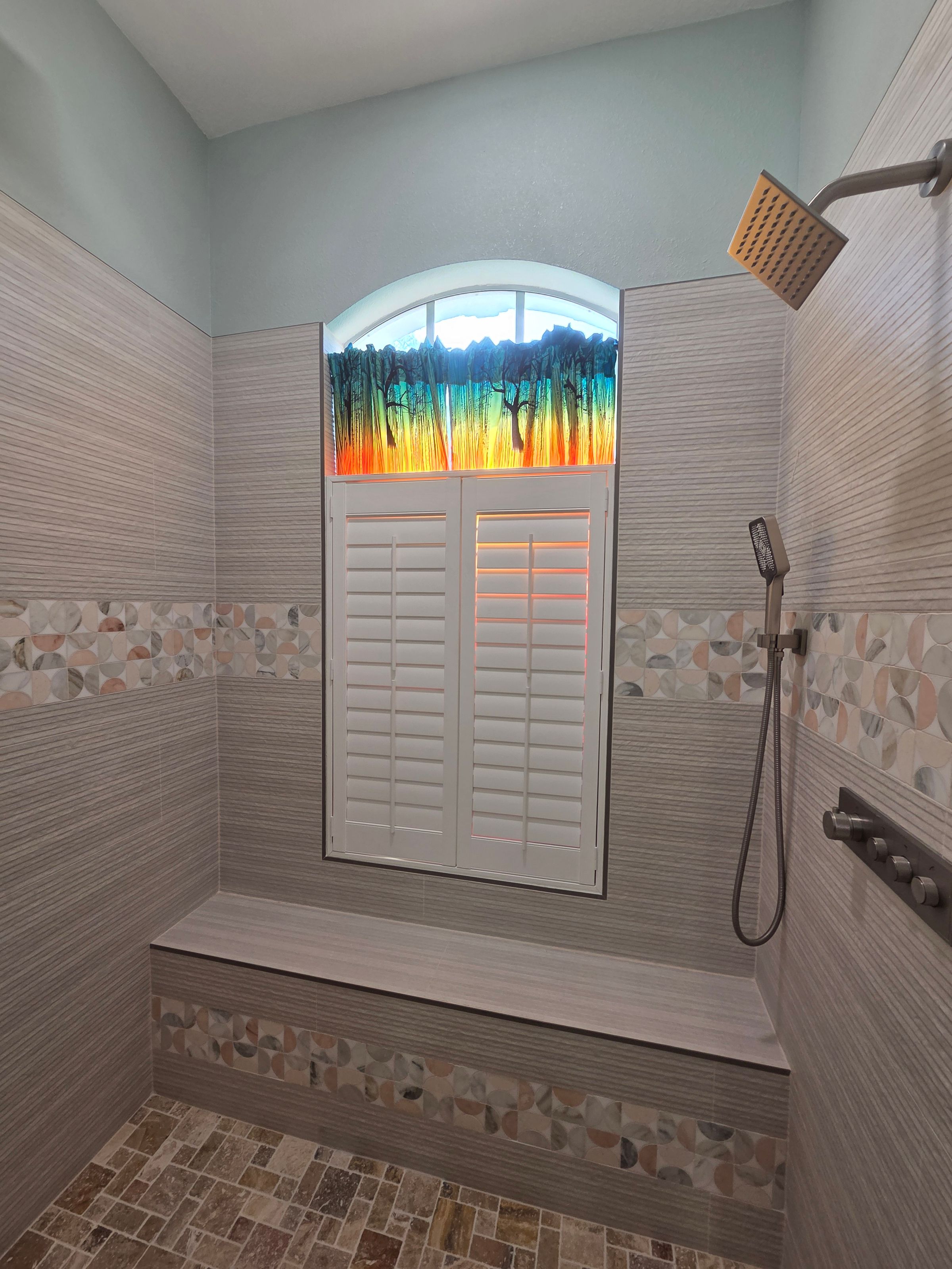 We installed high-end fixtures, luxurious tile, and a custom vanity to provide a relaxing and indulgent experience.