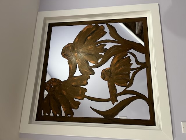 Metal sculpture by Janet Dornian inset in stairwall