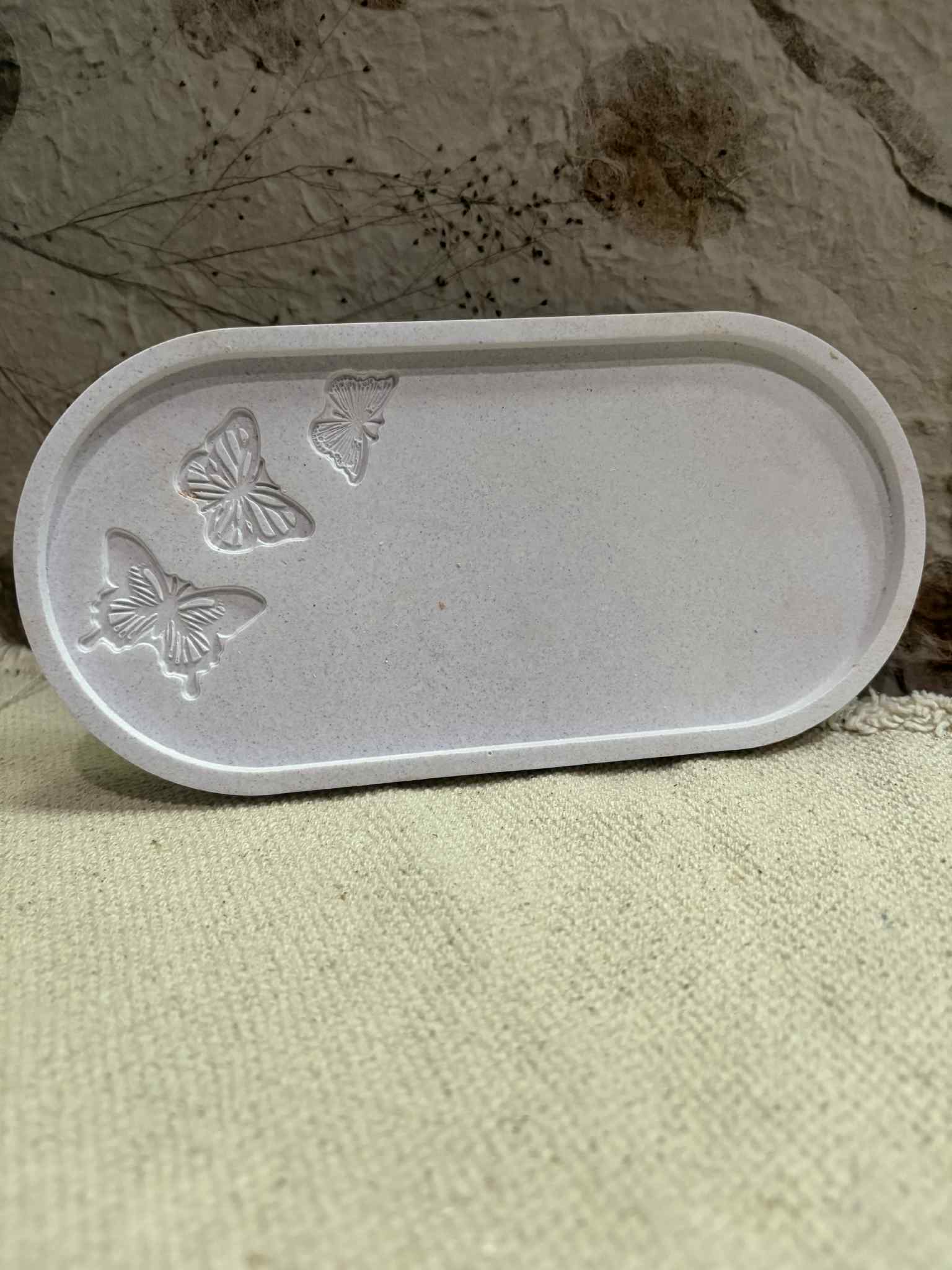 The Butterfly Tray features a beautiful design, combining elegance with practicality. Made from durable materials, it is versatile for serving, organizing, or decorative purposes, priced at $15.00.
