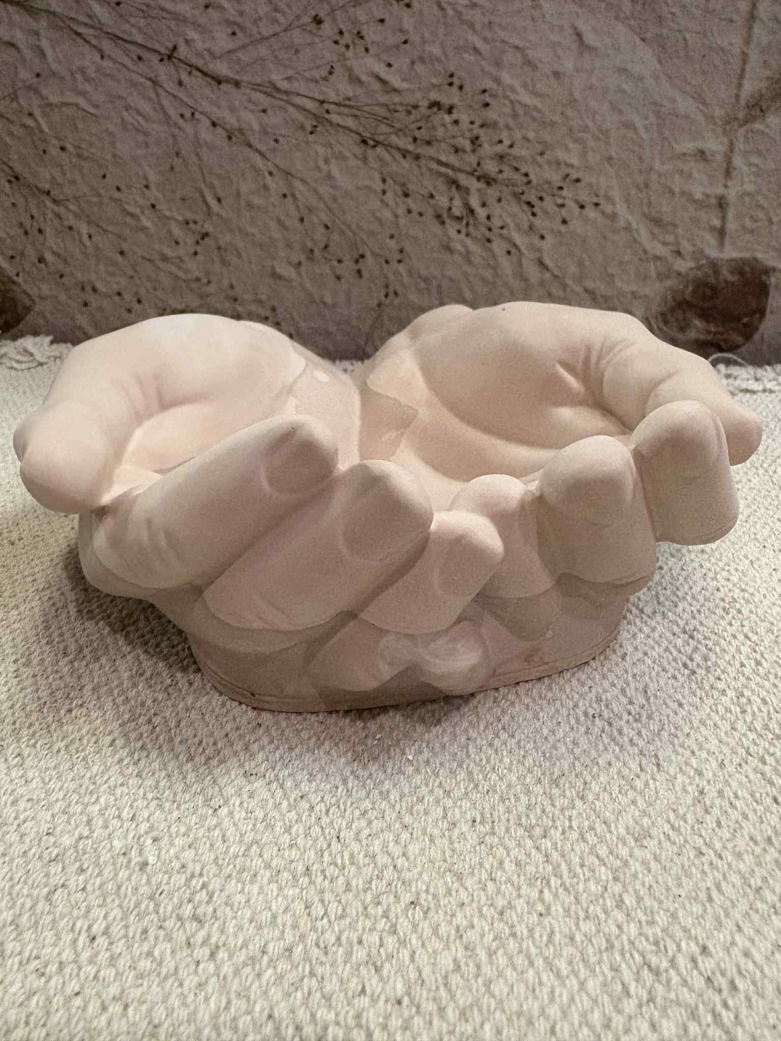 This hand-shaped candle vessel or trinket bowl combines a unique design with fine detailing, offering versatile usage as a sand candle container or storage for small items. Made from durable materials, it ensures lasting functionality and style for $25.00.