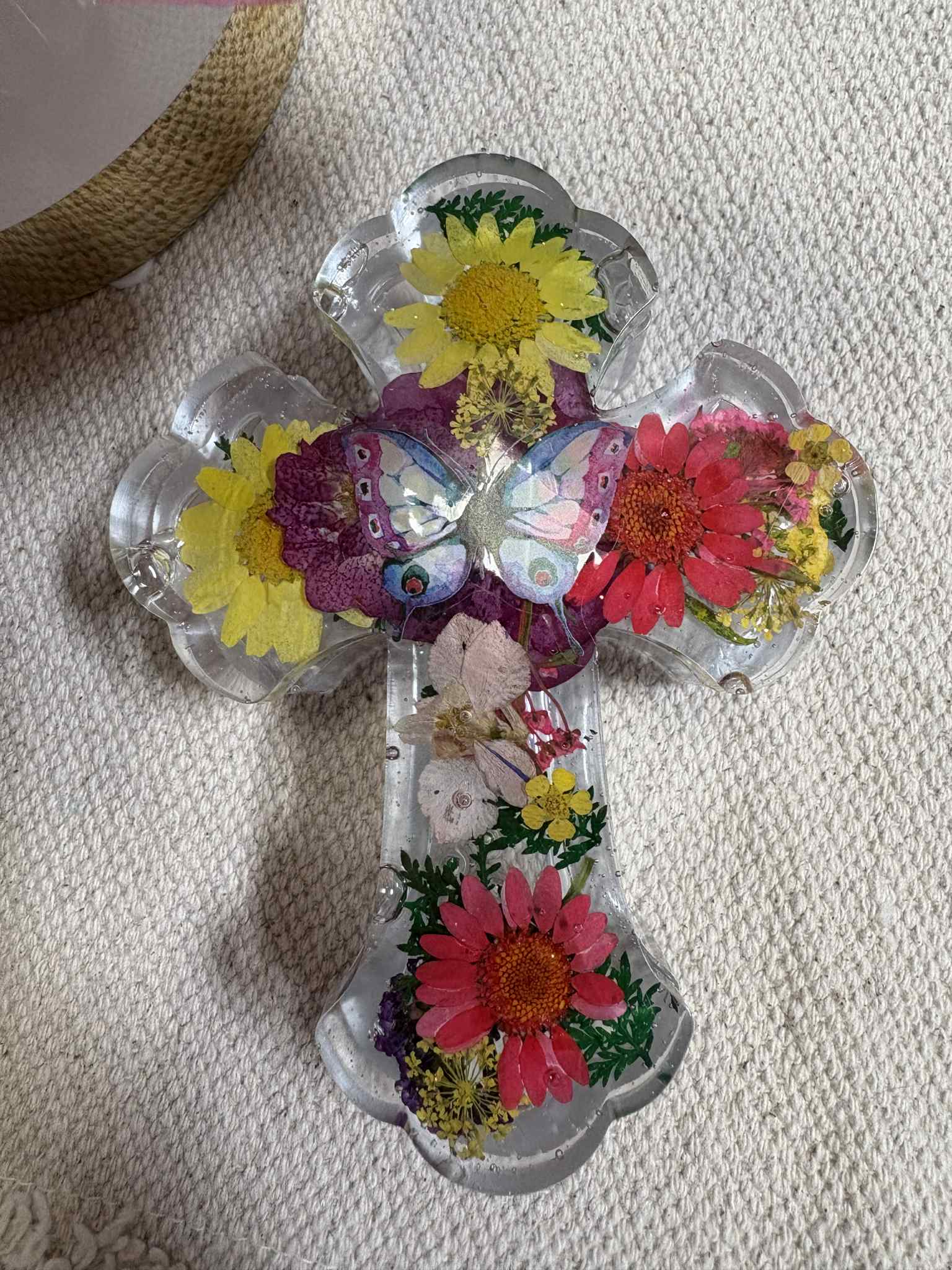 This handcrafted cross features real flowers, offering a unique blend of natural beauty and timeless design. Perfect for baby blessings, weddings, or communion, it adds an elegant touch to any special occasion for just $10.00.