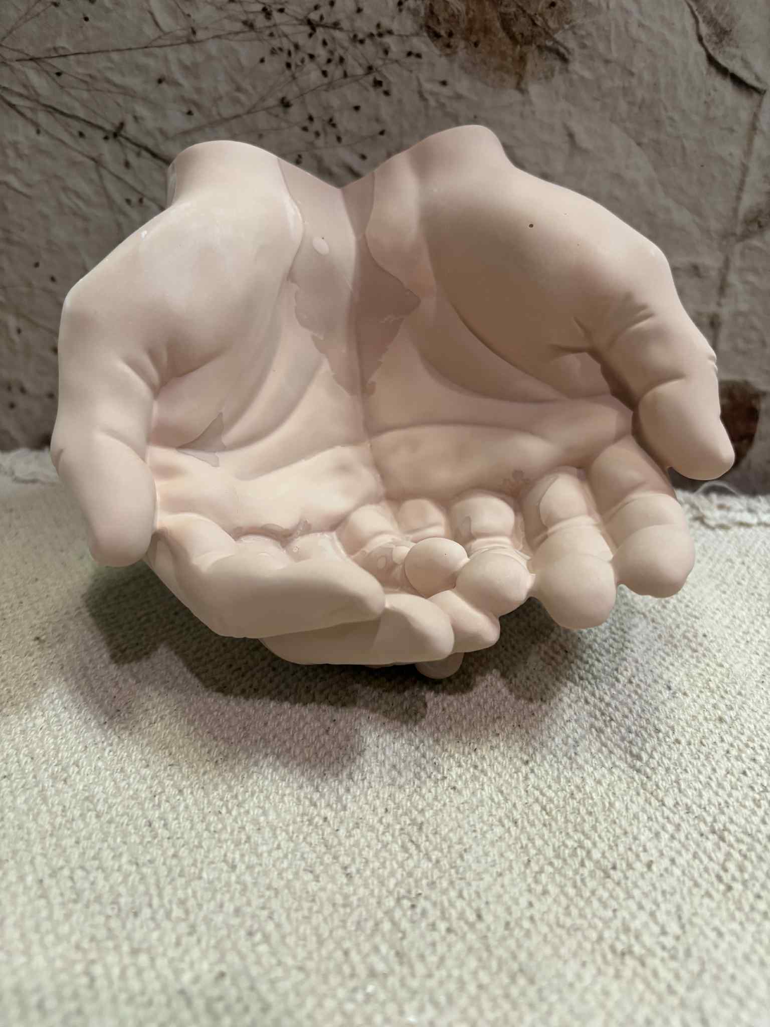 This hand-shaped candle vessel or trinket bowl combines a unique design with fine detailing, offering versatile usage as a sand candle container or storage for small items. Made from durable materials, it ensures lasting functionality and style for $25.00.