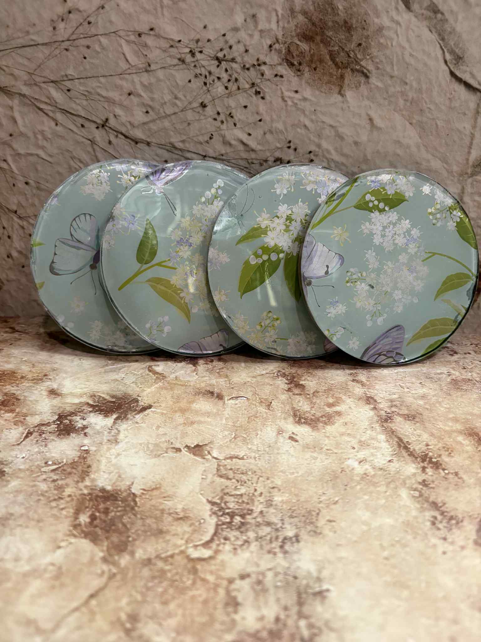 These coasters are made from durable materials designed to protect surfaces while adding a touch of style. Available in a variety of colors and customizable designs, each set is priced at $20.00.