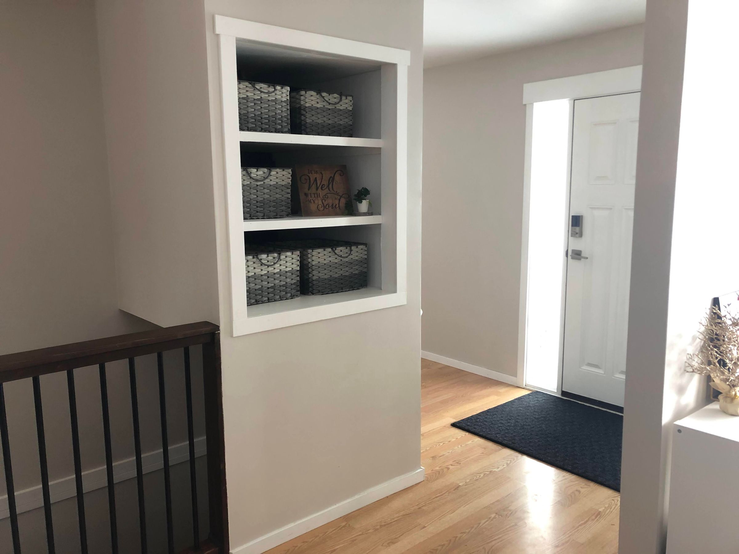 Custom Entrance - Removed non-bearing wall, built in storage, stair railing, retrofit door