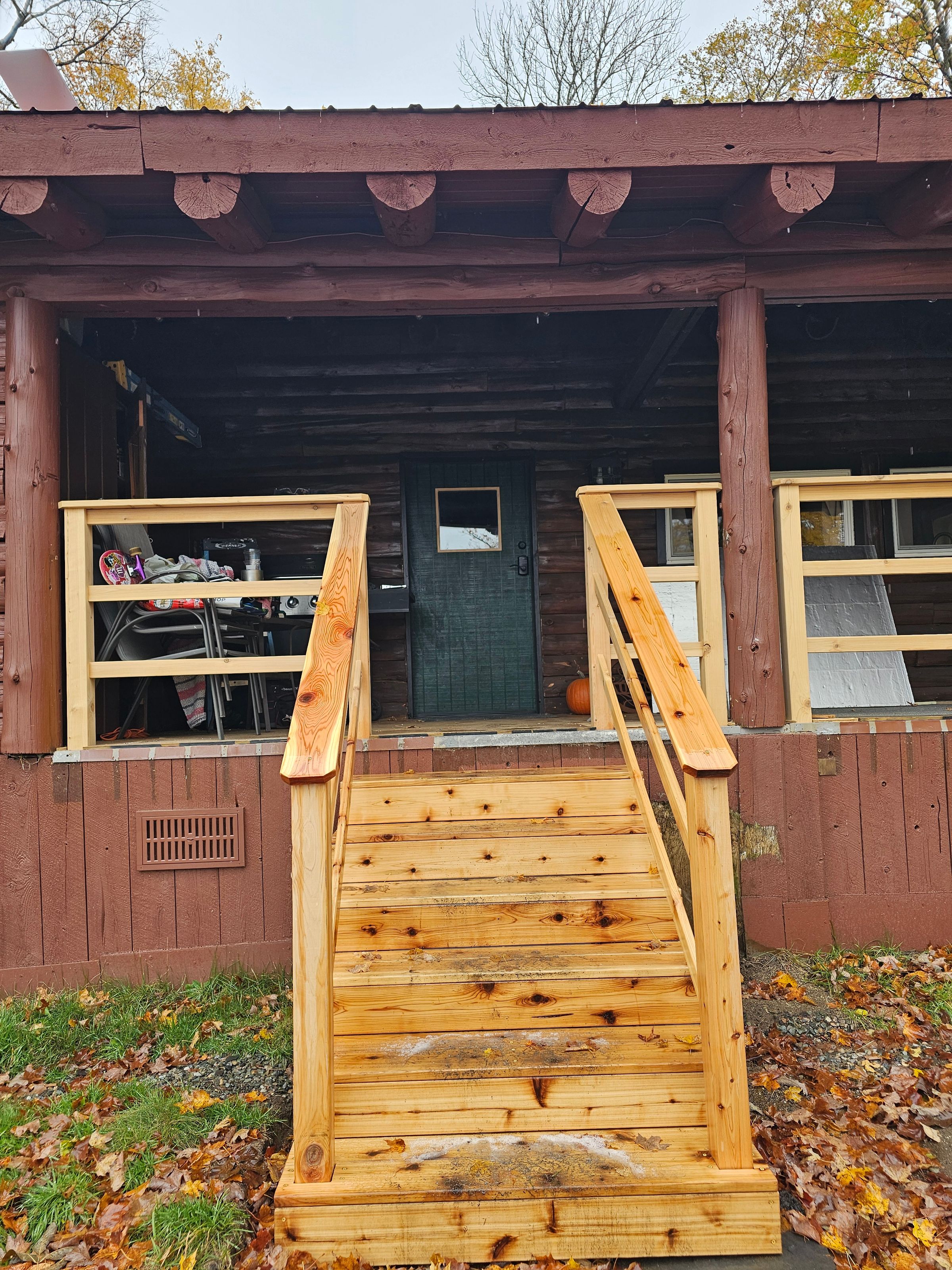 NEW CEDAR STAIRS, RAILINGS, AND CUSTOM BUILT FRONT DOOR