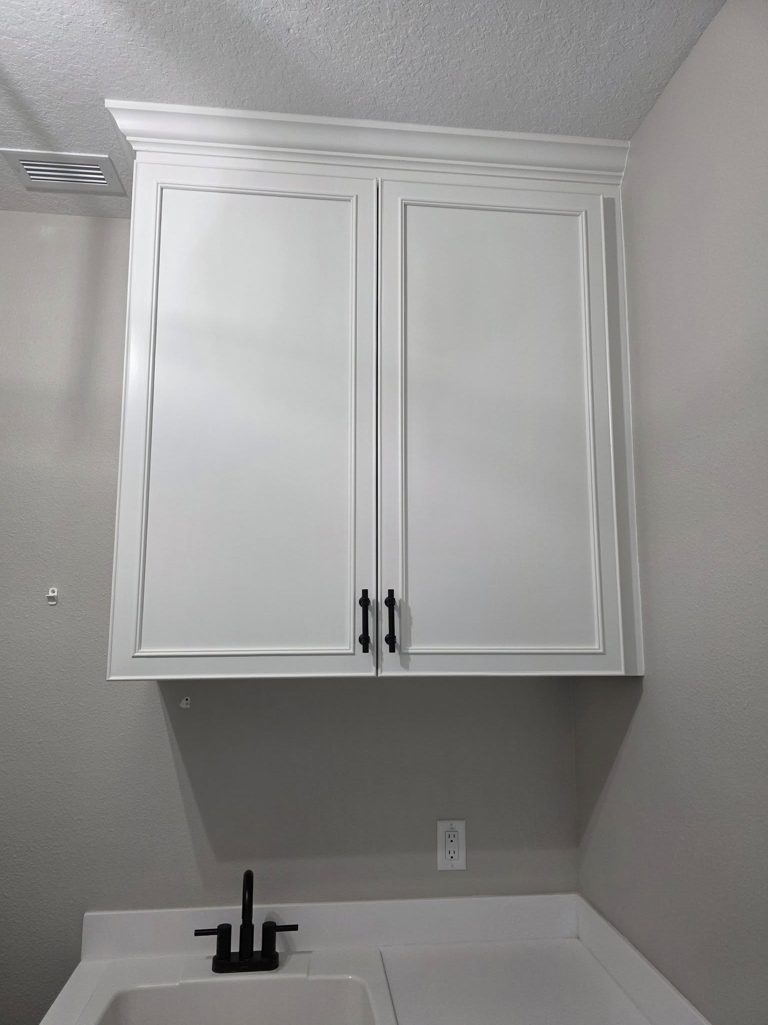 48"x44"x16" laundry cabinet.