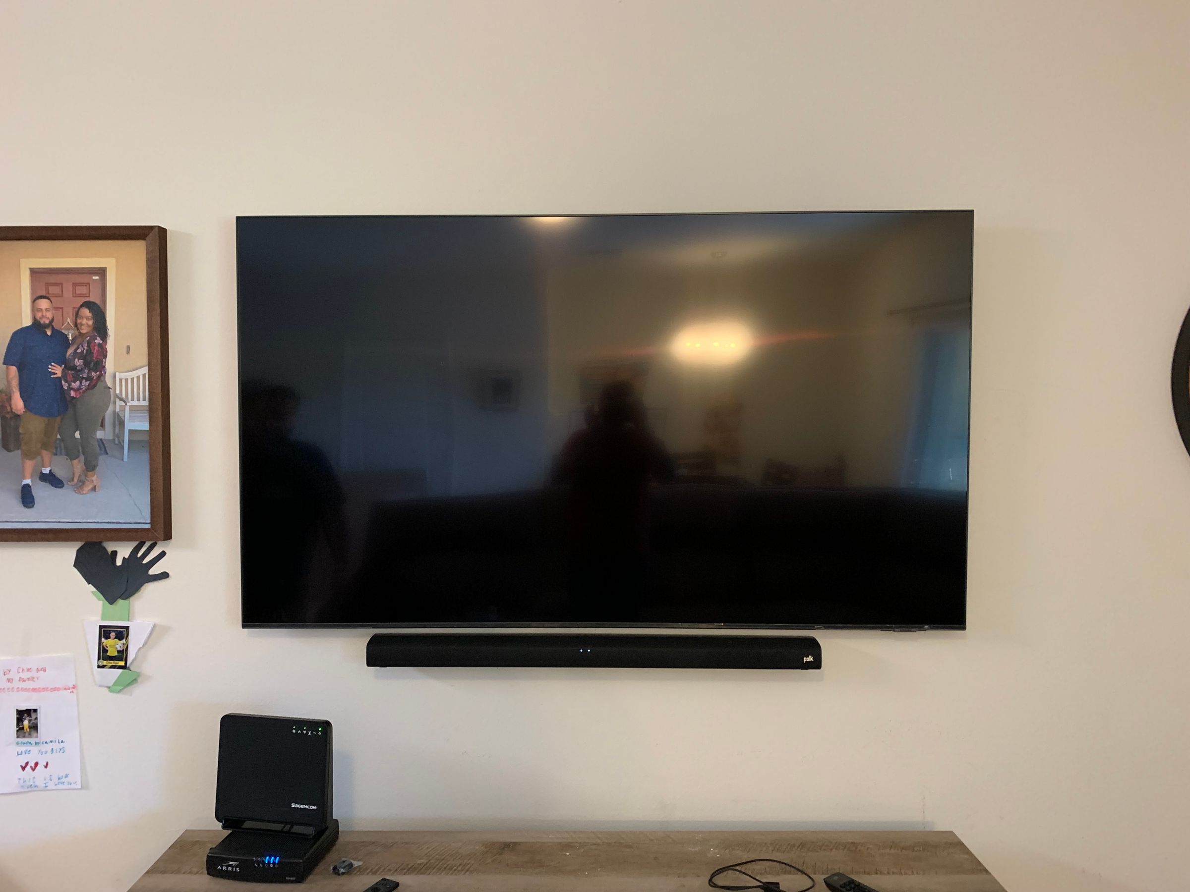 Large flat-screen TV mounted with compact soundbar installed professionally in Homestead, FL.