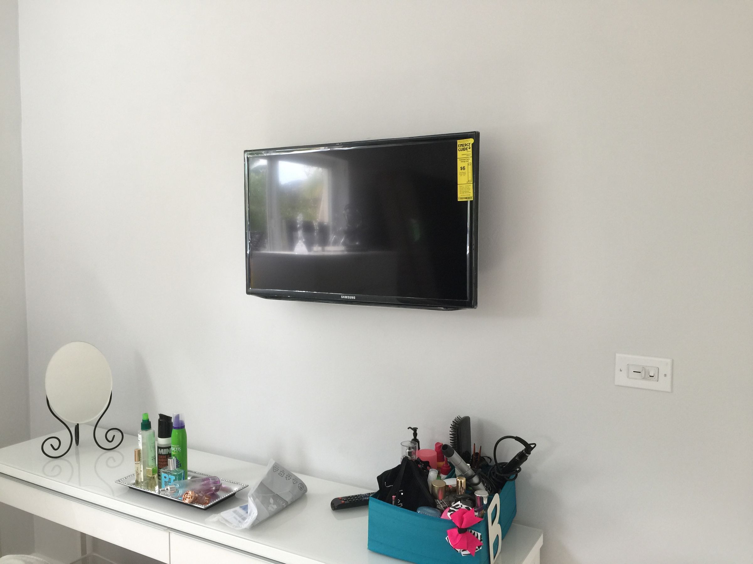 Bedroom TV mount installation with low-profile bracket in Miami-Dade County.